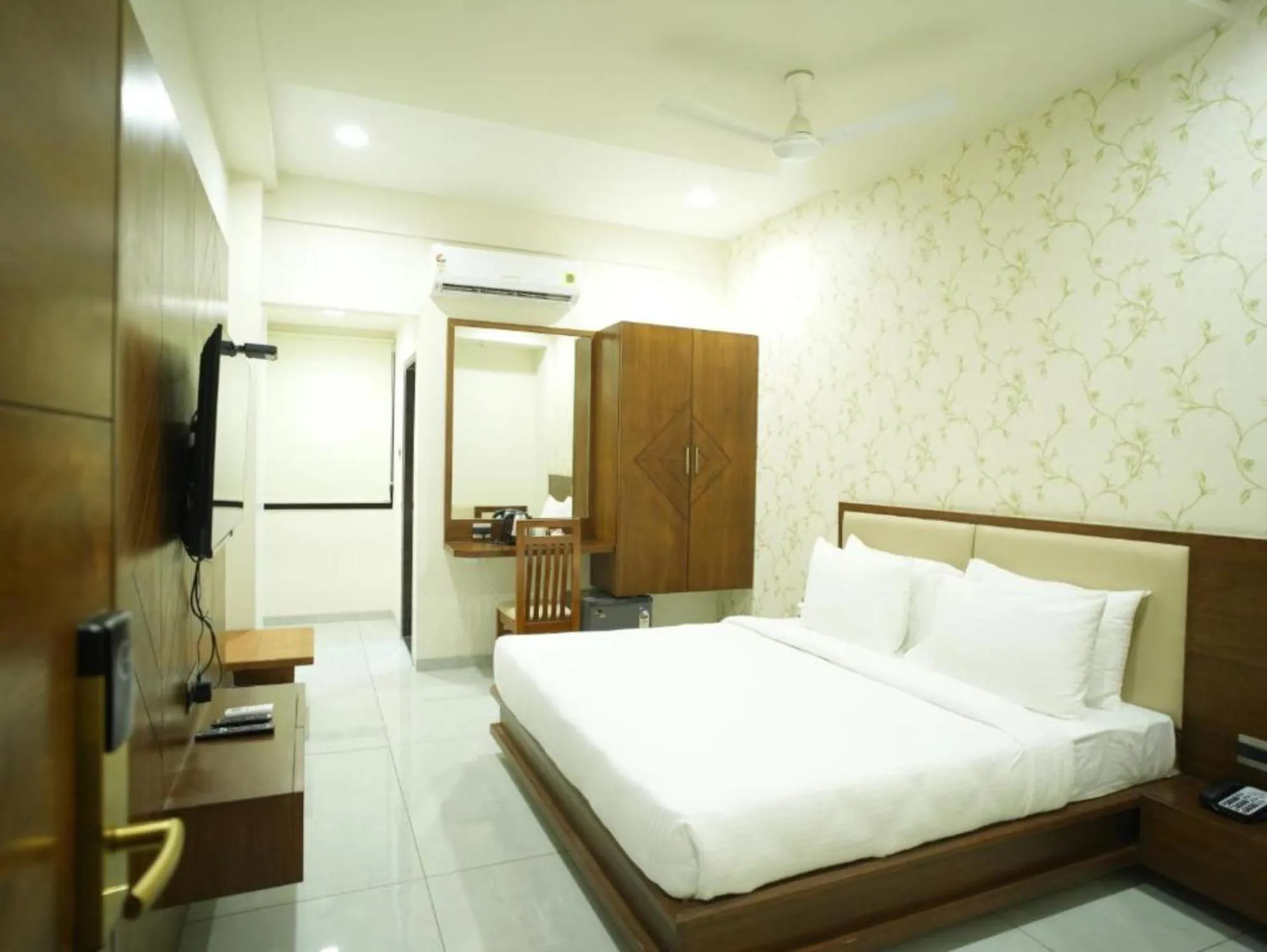 Bed in Pam Premium Hotel Vadodara