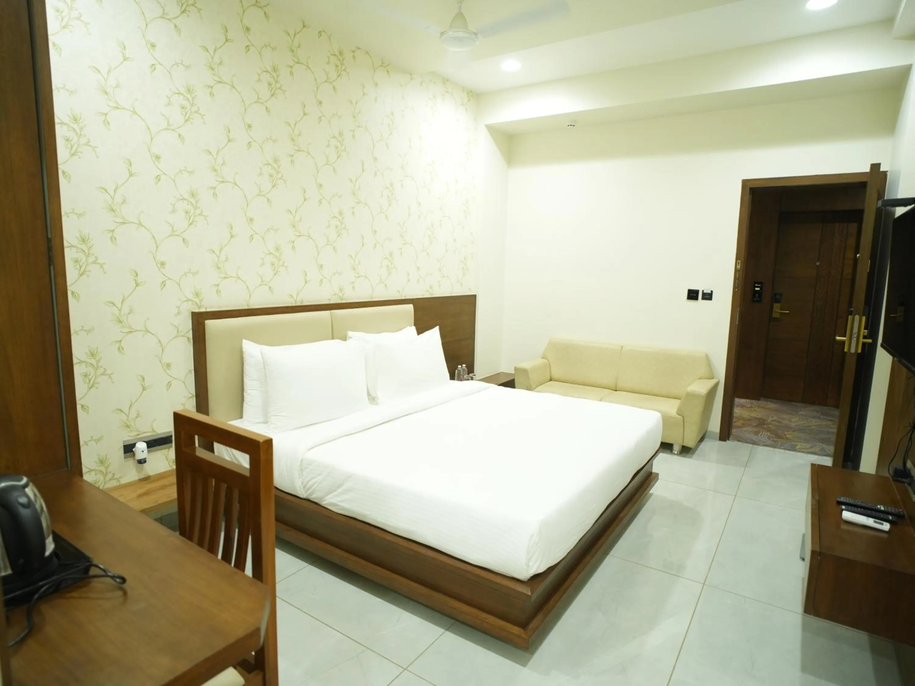 Bed in Pam Premium Hotel Vadodara