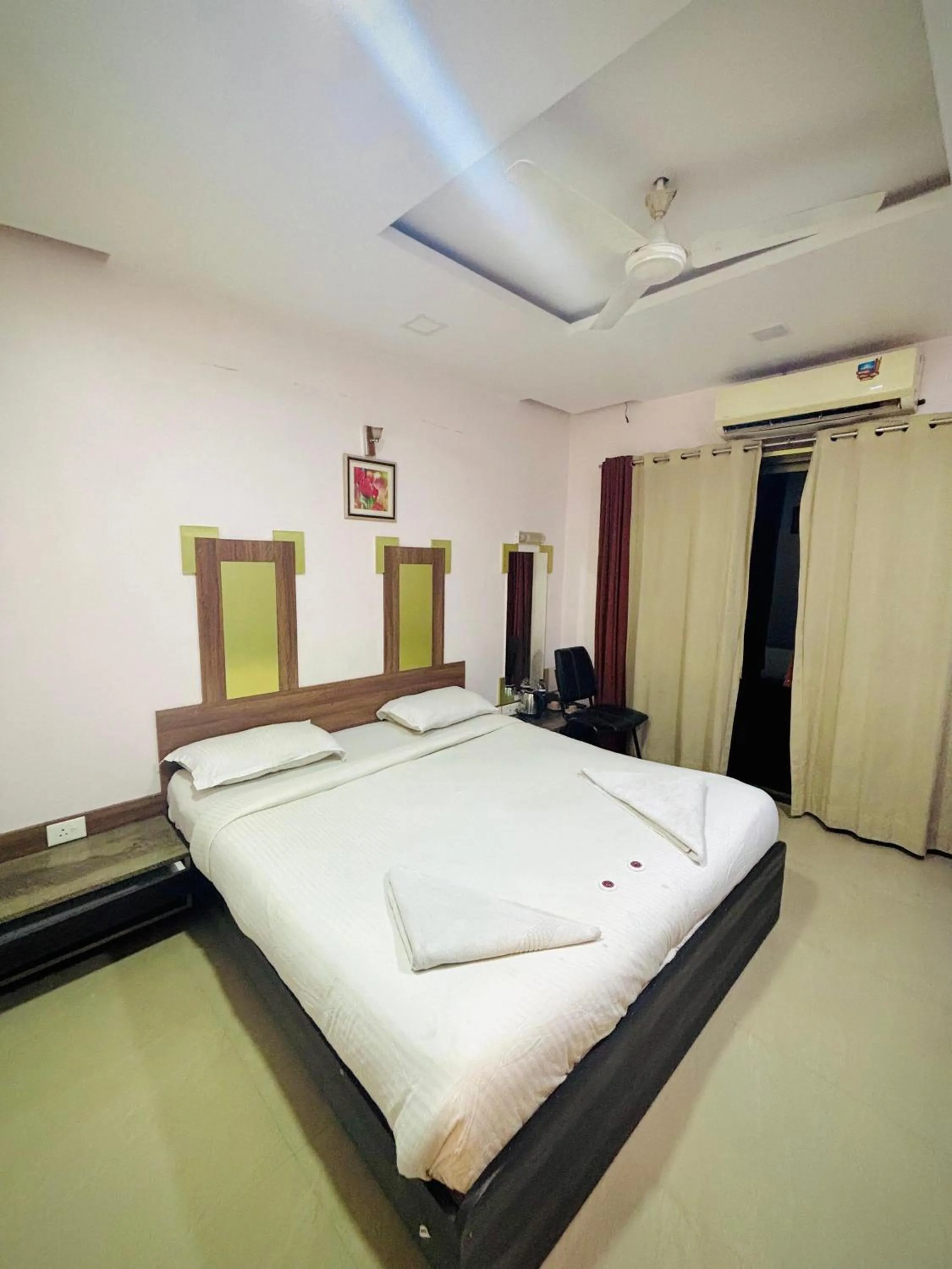 Bed in Hotel Laxmi Residency
