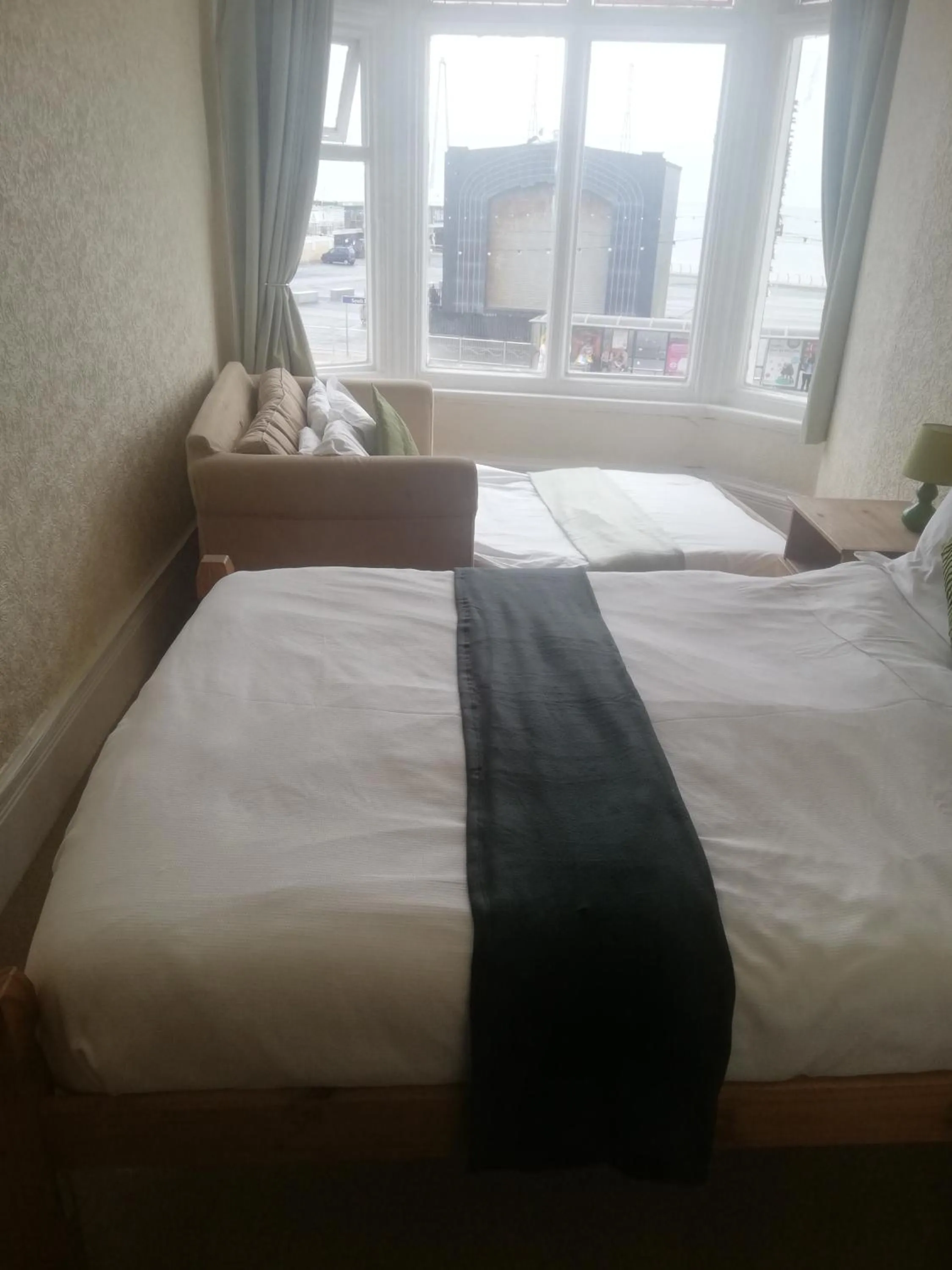 Bed in Camelot Seafront Hotel