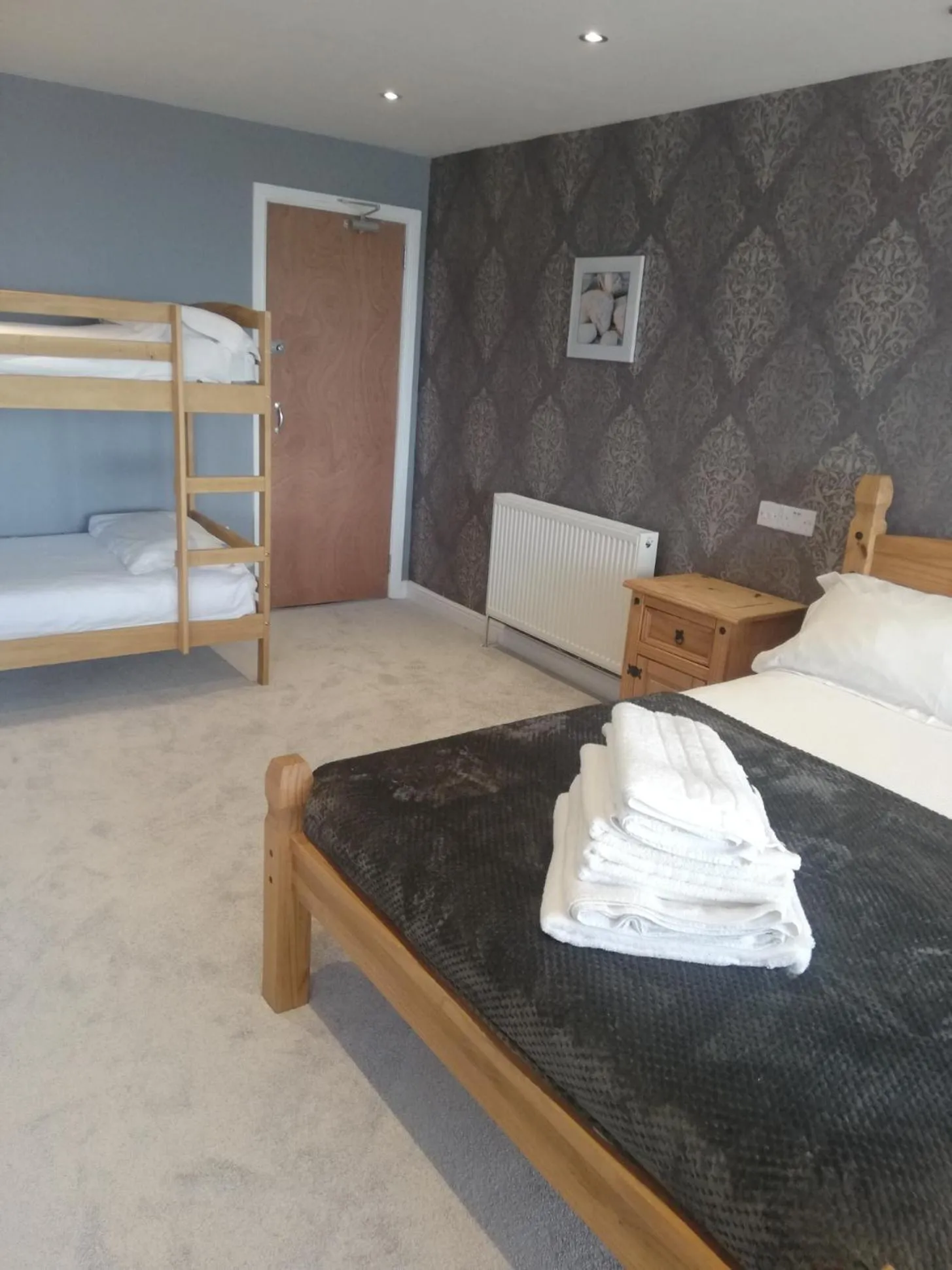 Bed in Camelot Seafront Hotel