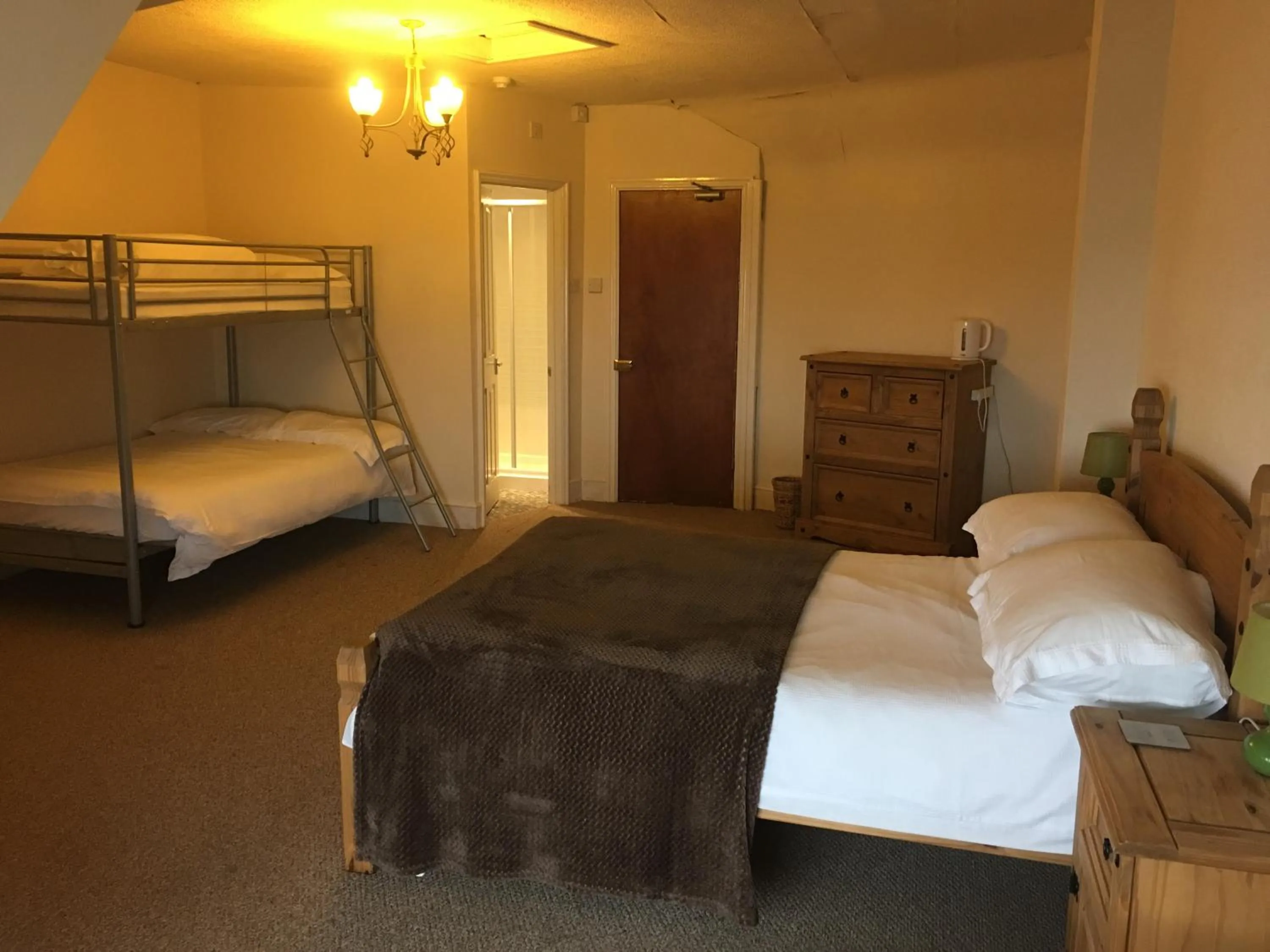 Bed in Camelot Seafront Hotel