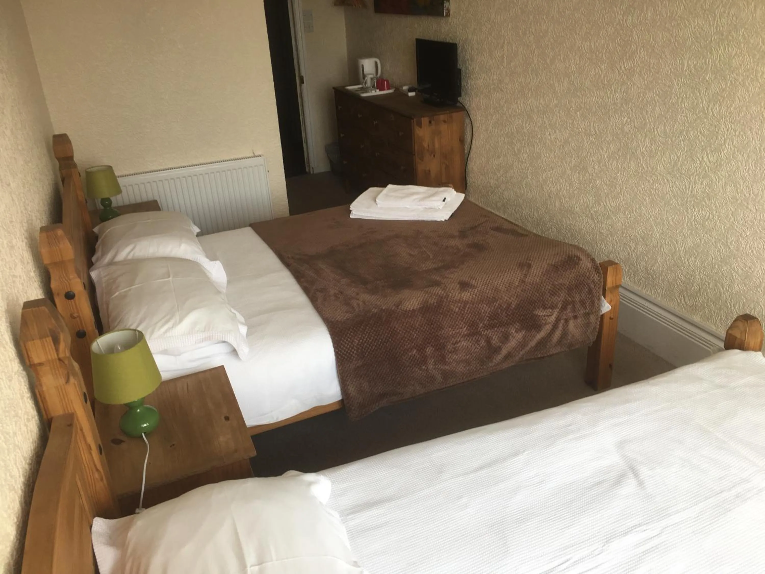 Bed in Camelot Seafront Hotel