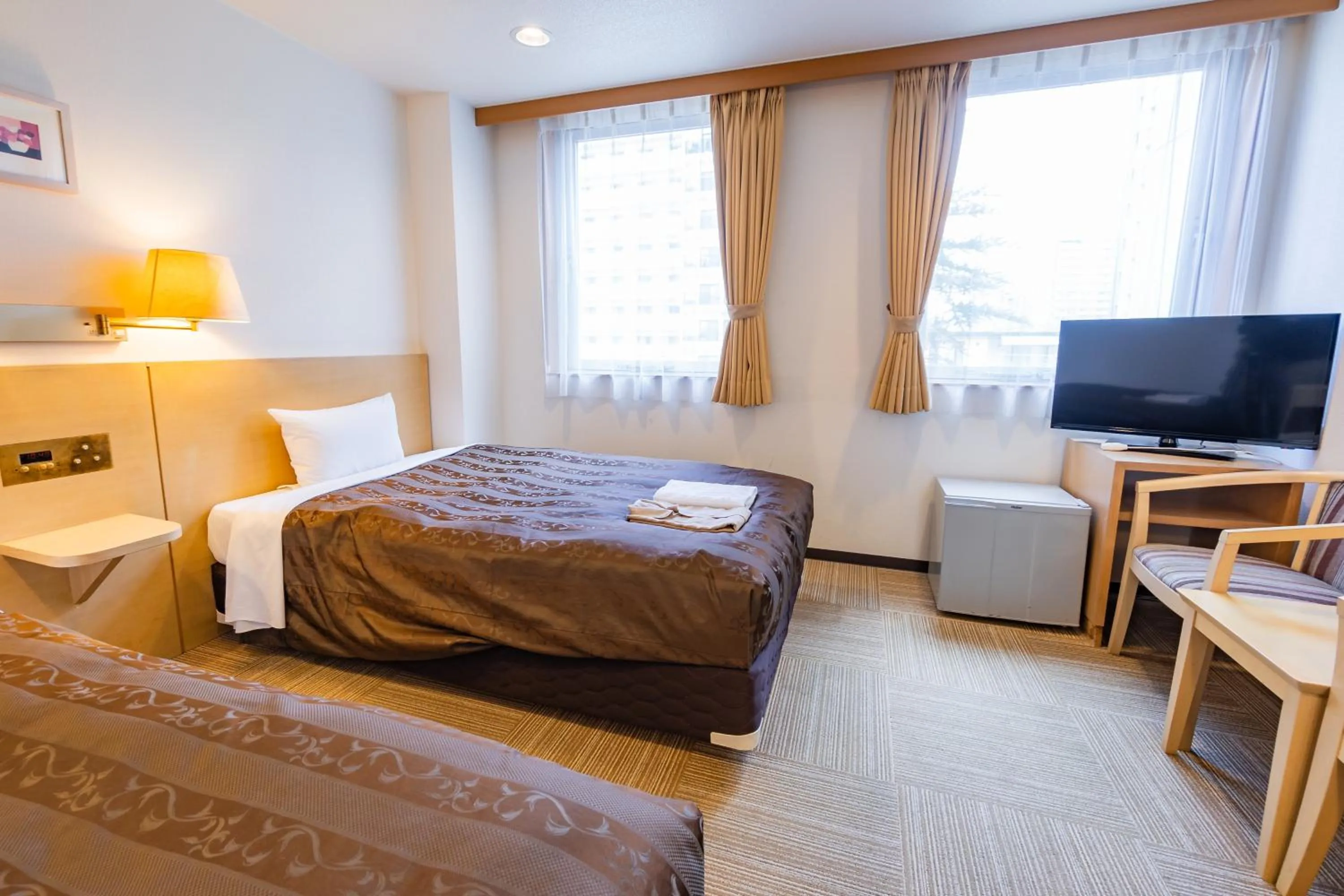 Bed in Okano Hotel