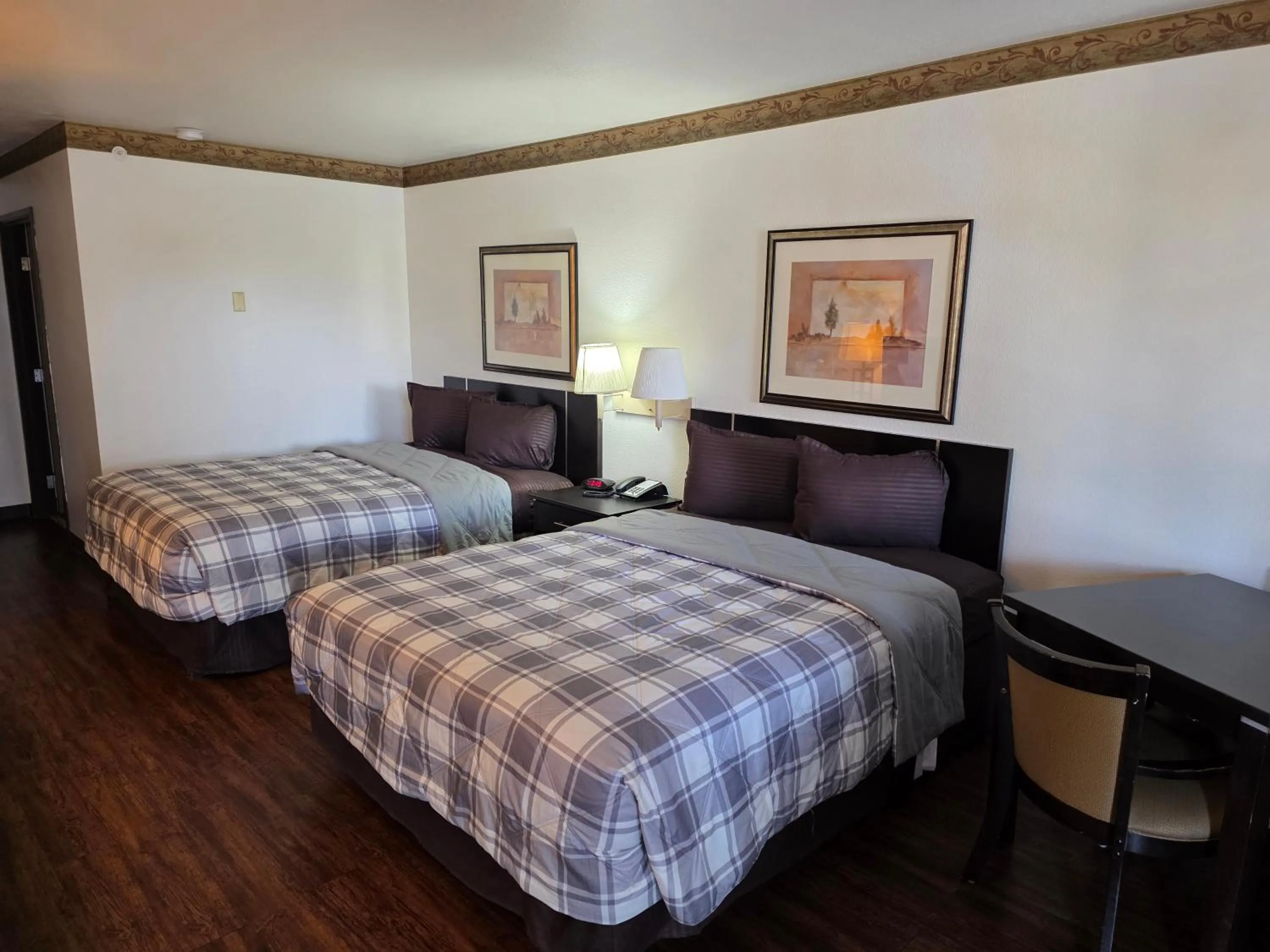 Bed in American Inn & Suites