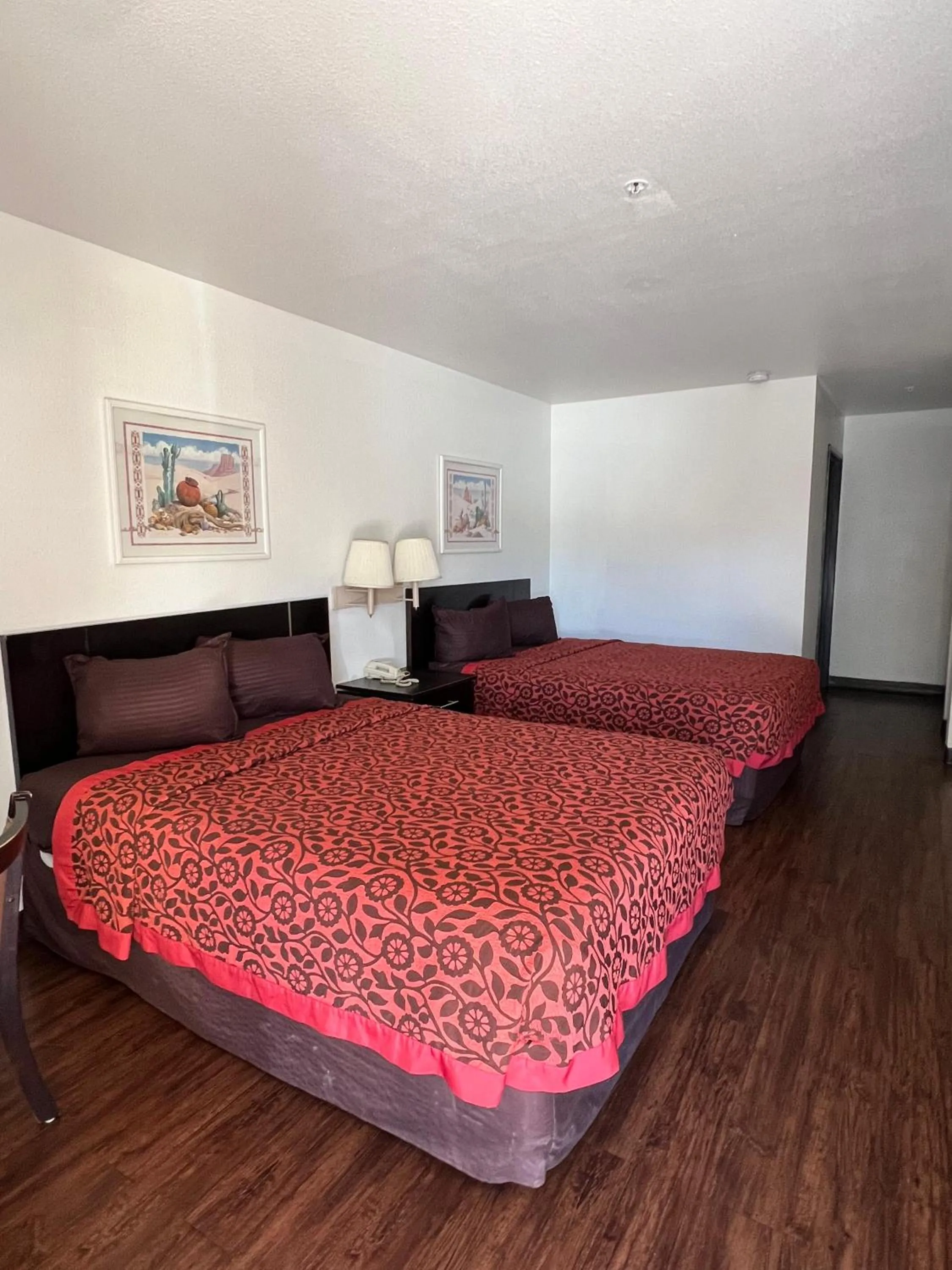 Bed in American Inn & Suites