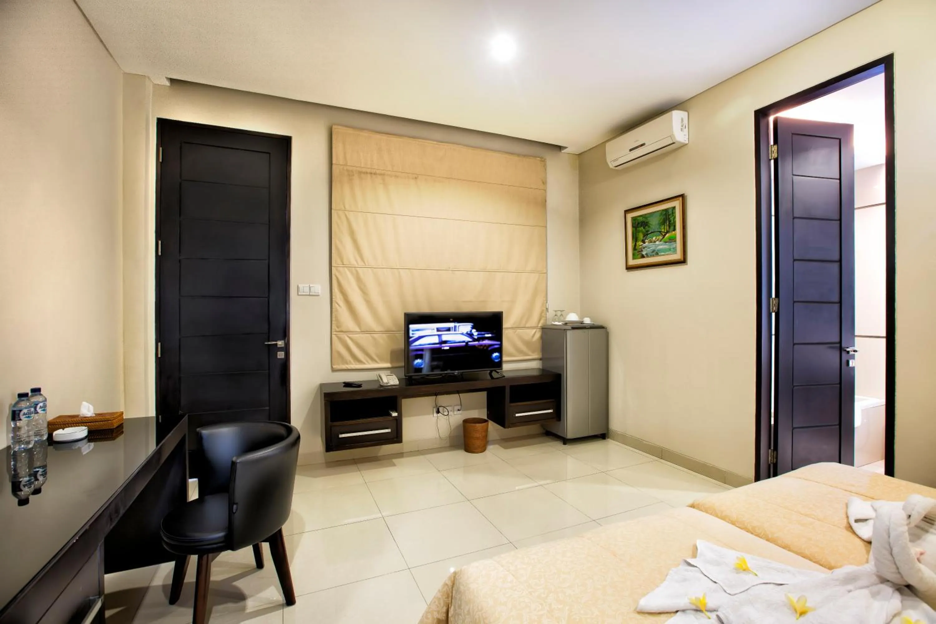 Bed in InKuta Residence and Villa