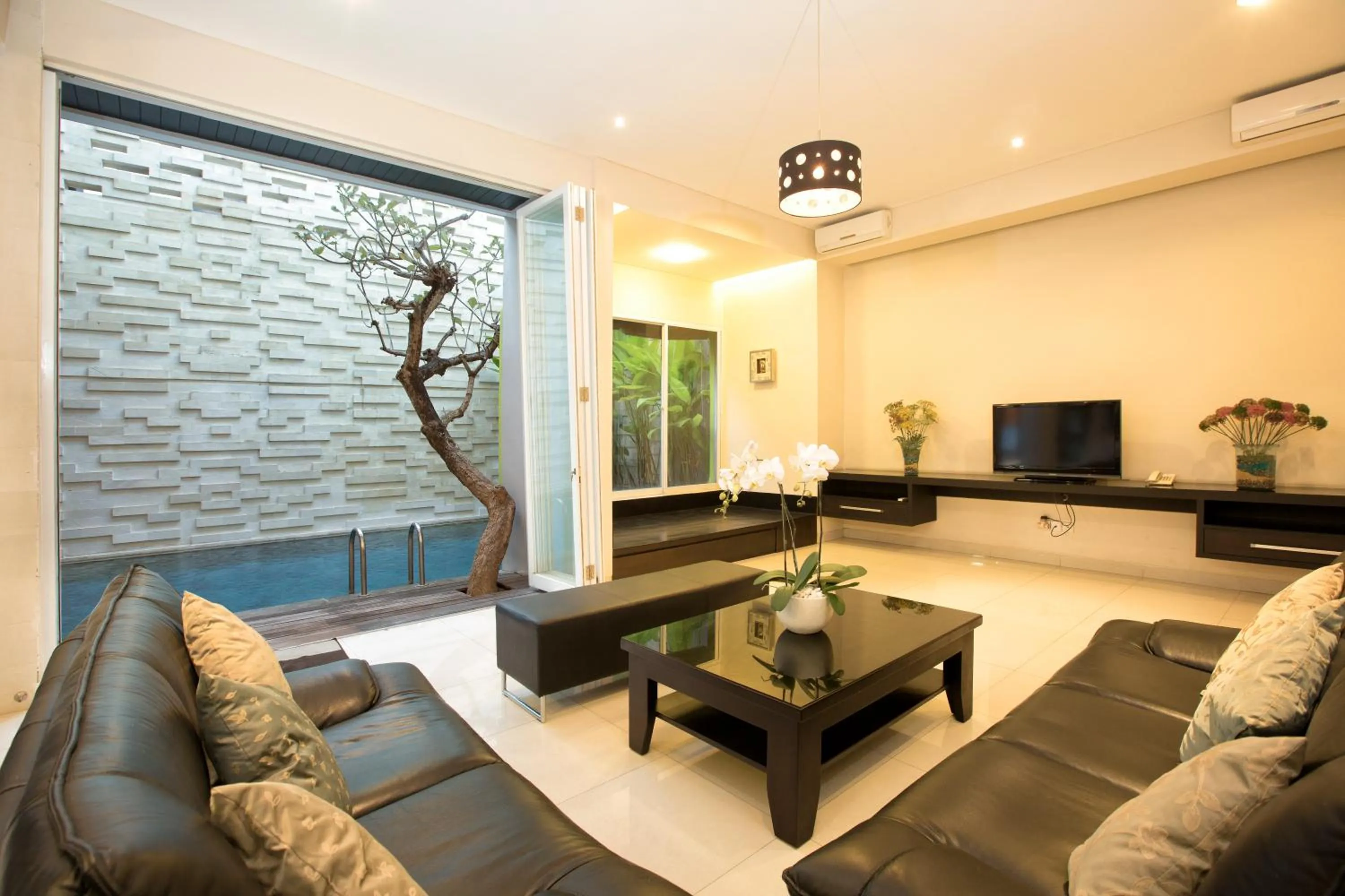 Communal lounge/ TV room in InKuta Residence and Villa