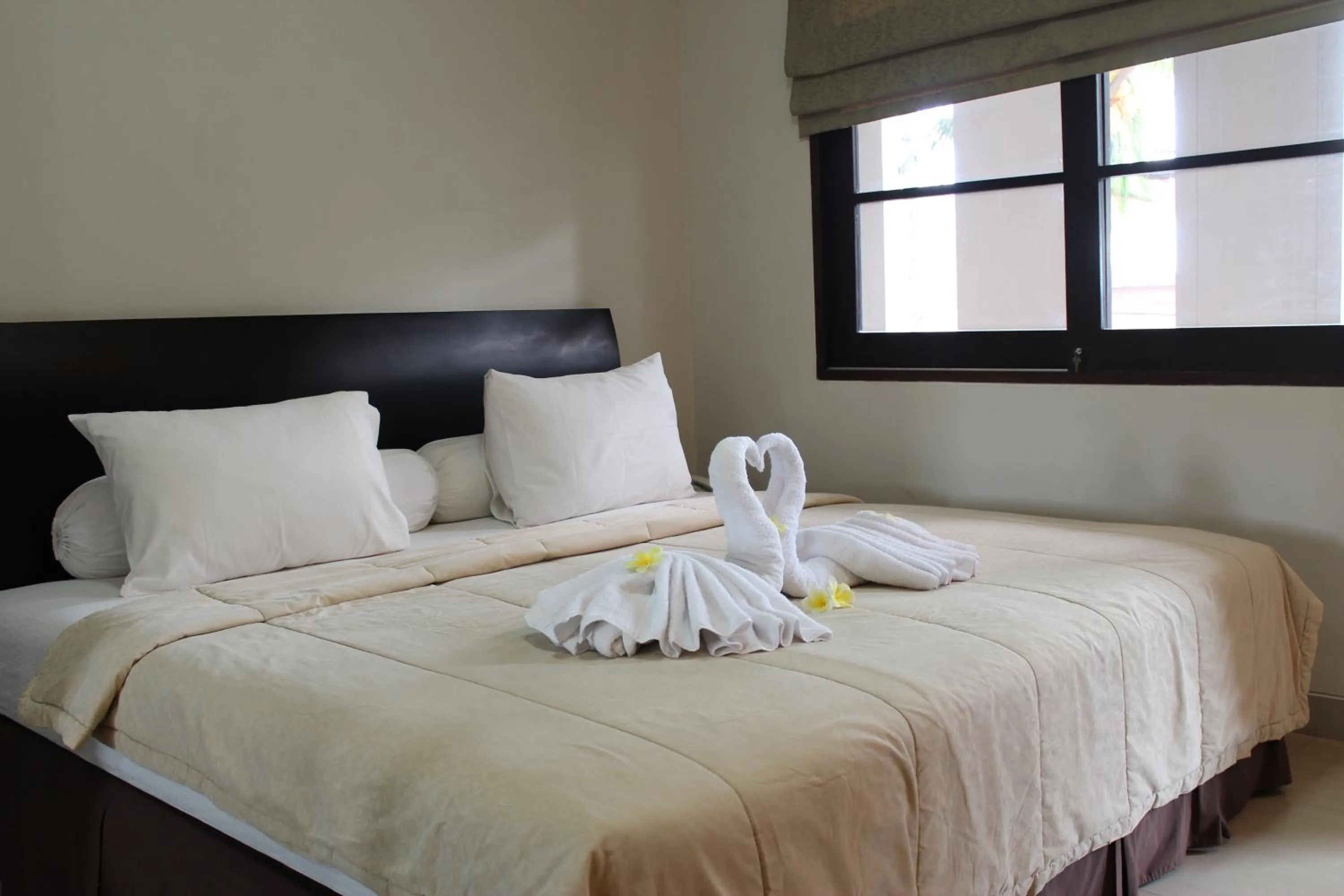 Bed in InKuta Residence and Villa