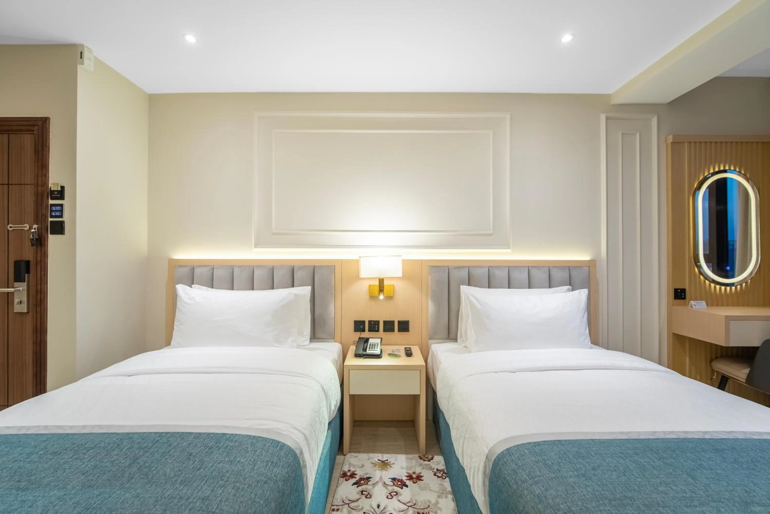 Bed in Grand Ambassador Hotel