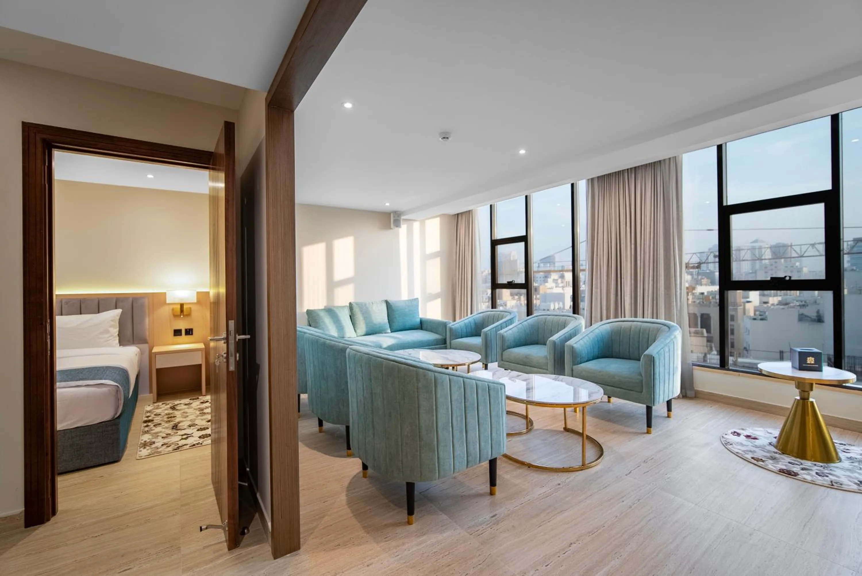 Living room, Bed in Grand Ambassador Hotel