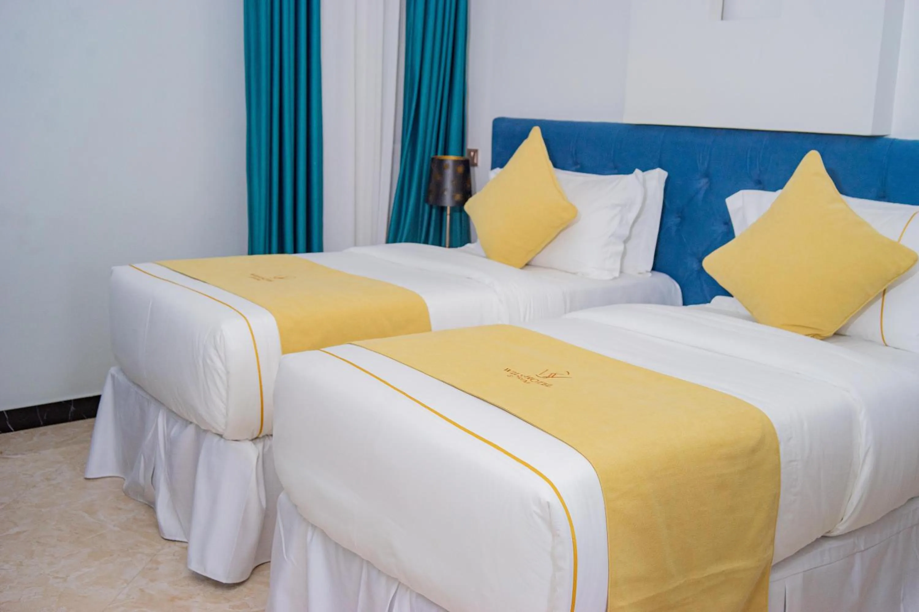 Bed in Wils Hotel Supreme