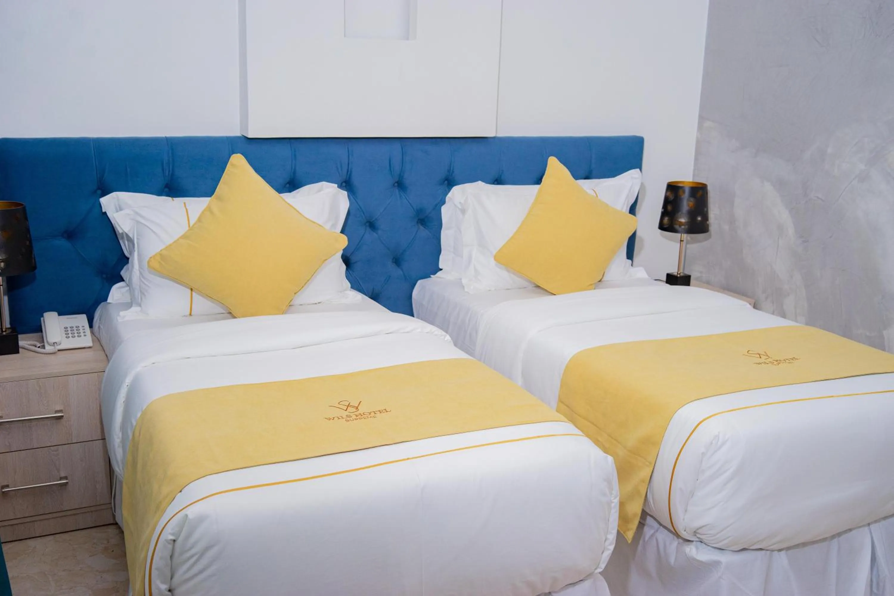 Bed in Wils Hotel Supreme