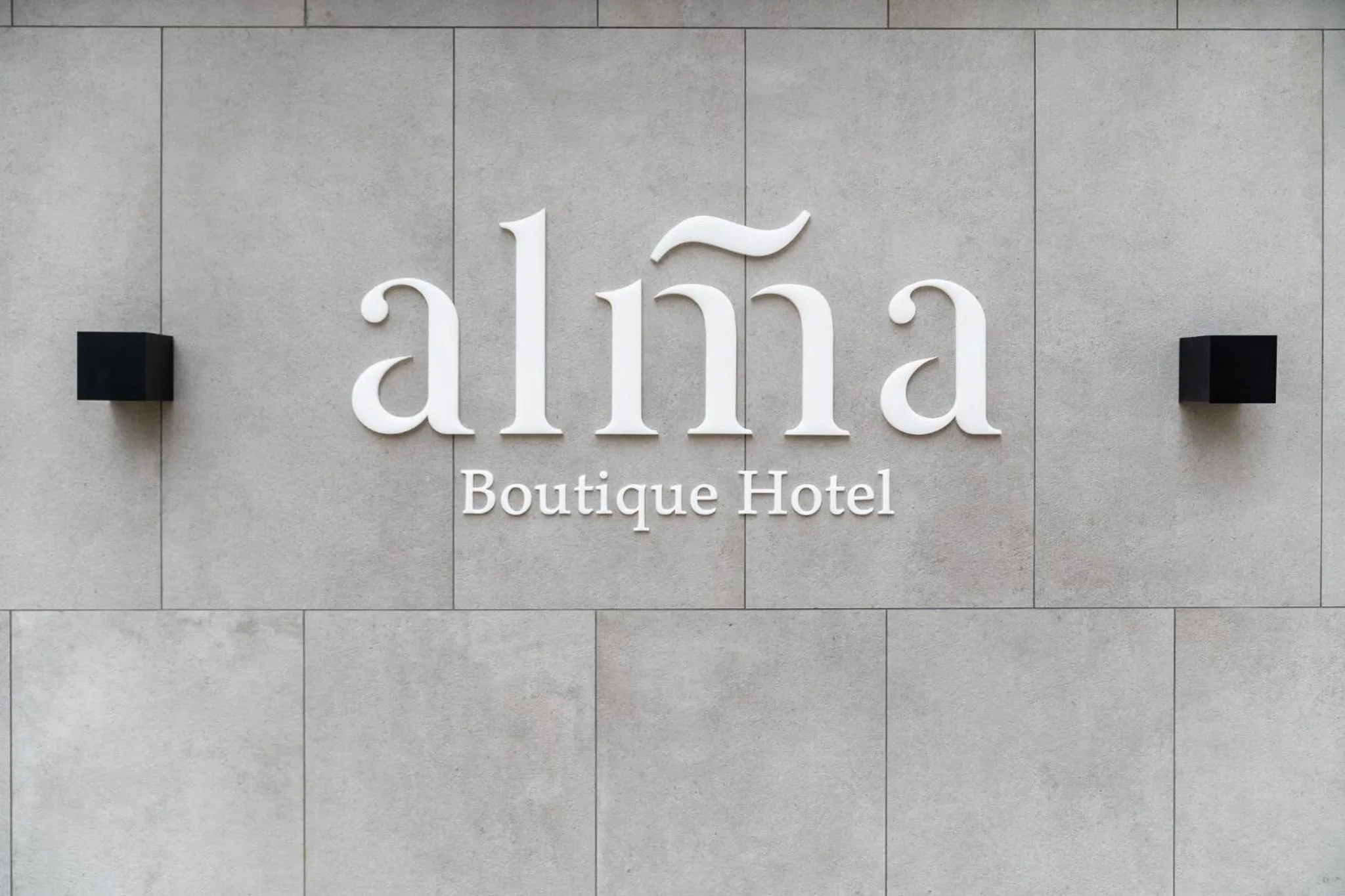 Property logo or sign in Alma Hotel