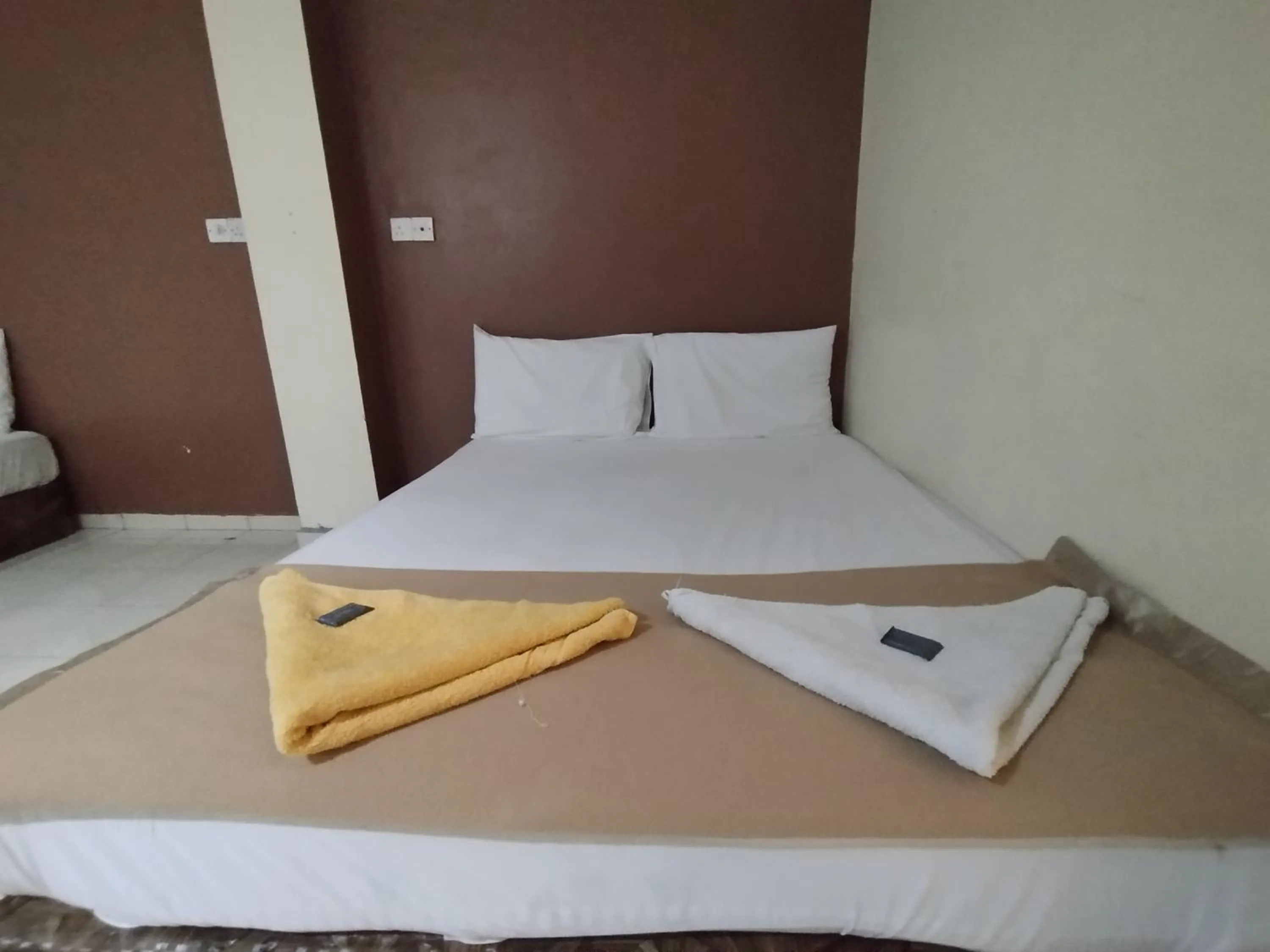 Bed in Sentosa Villa Hotel