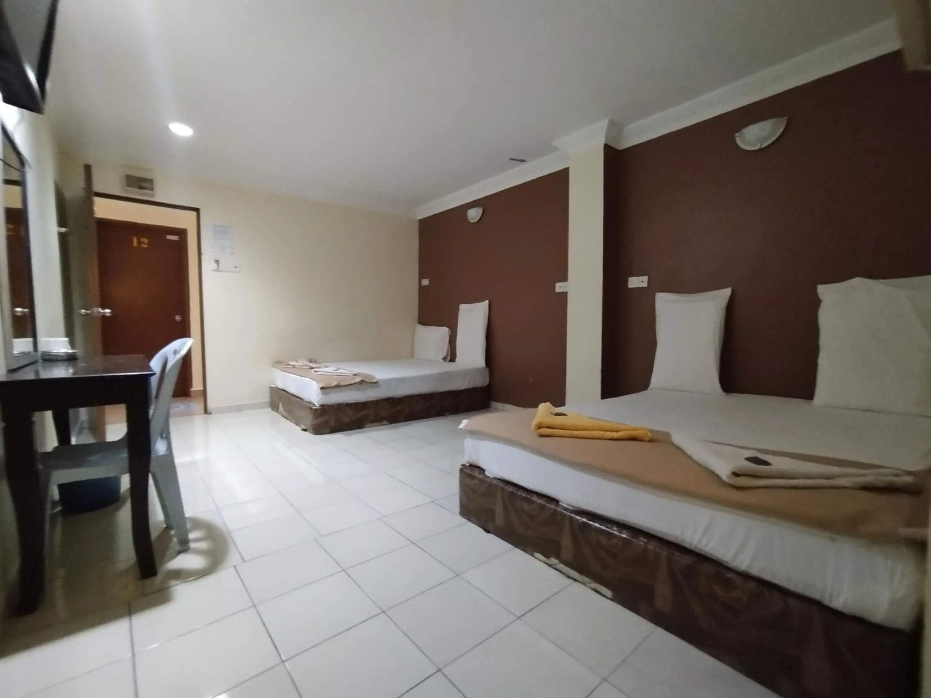 Bed in Sentosa Villa Hotel