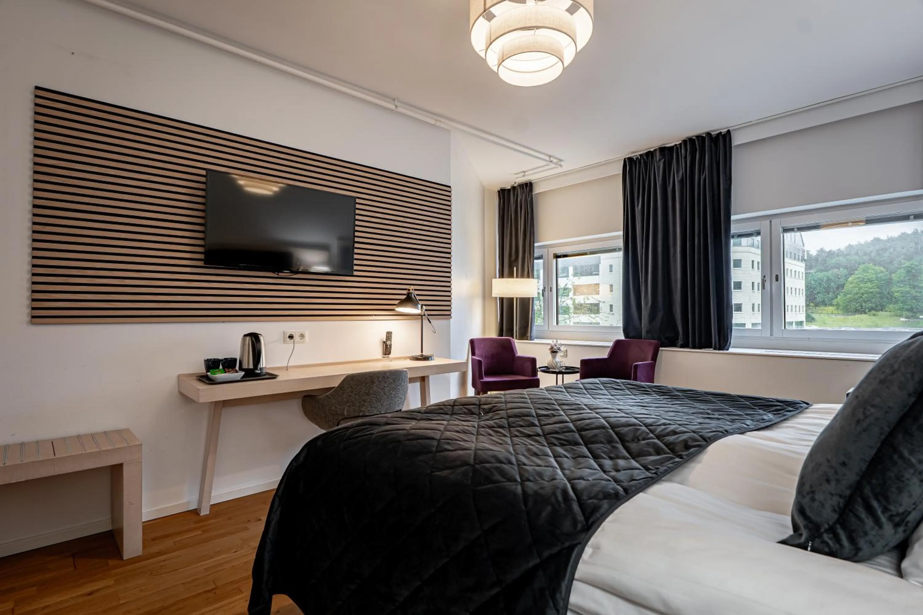 Bed in Injoy Premium Hotel Solna