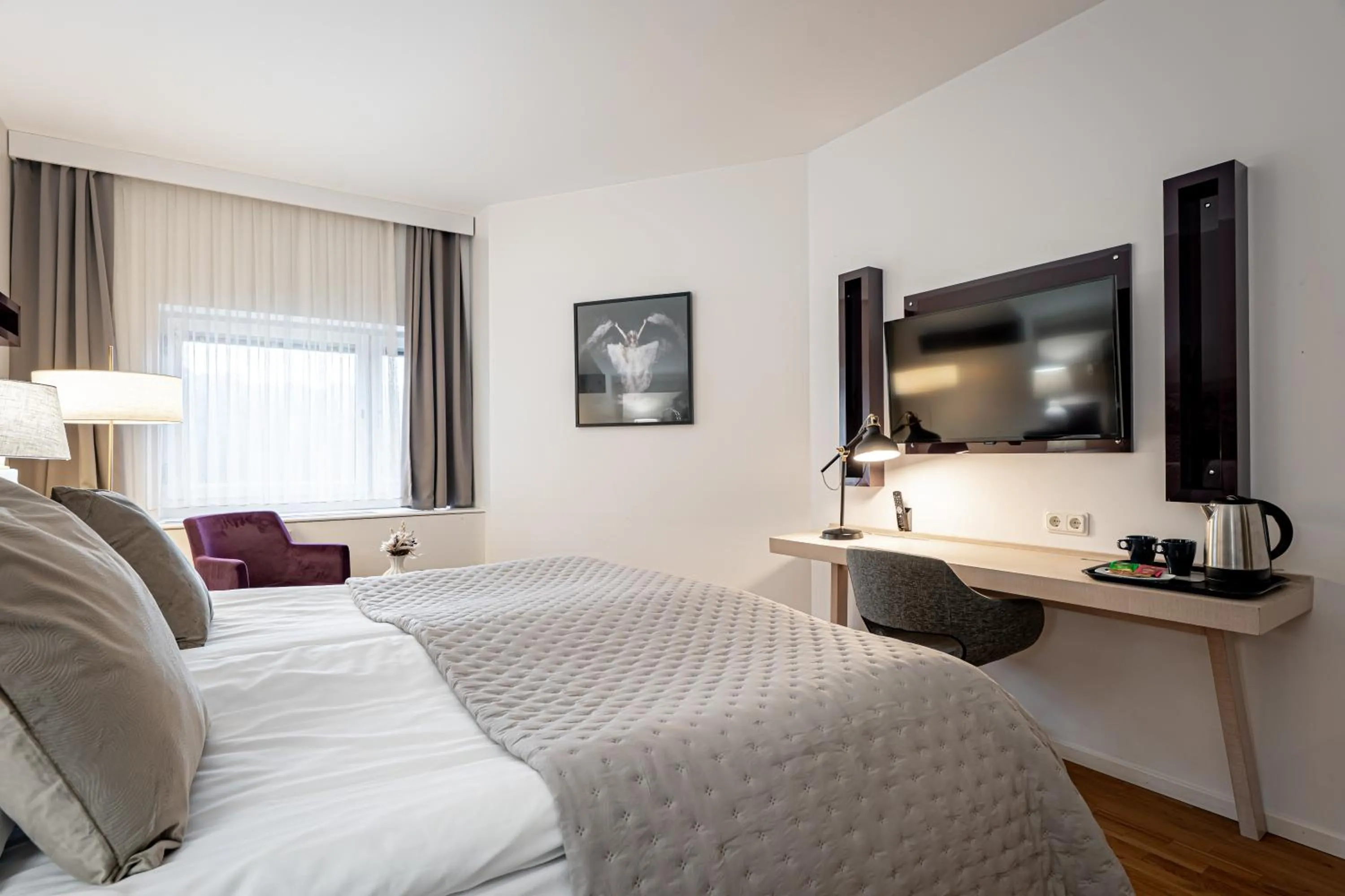 Bed in Injoy Premium Hotel Solna