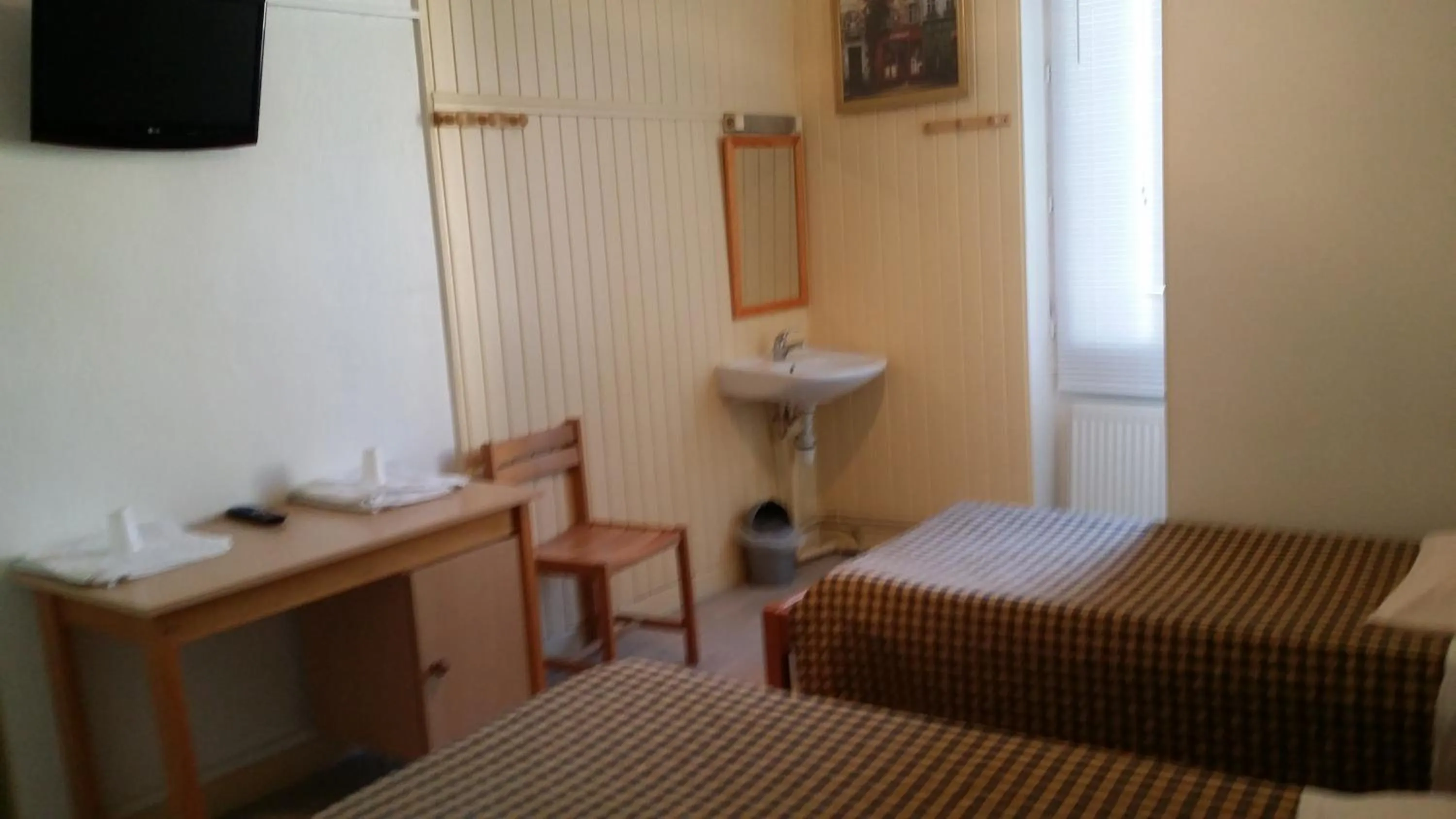 Bed, TV/Entertainment Center in Hotel Le Tram