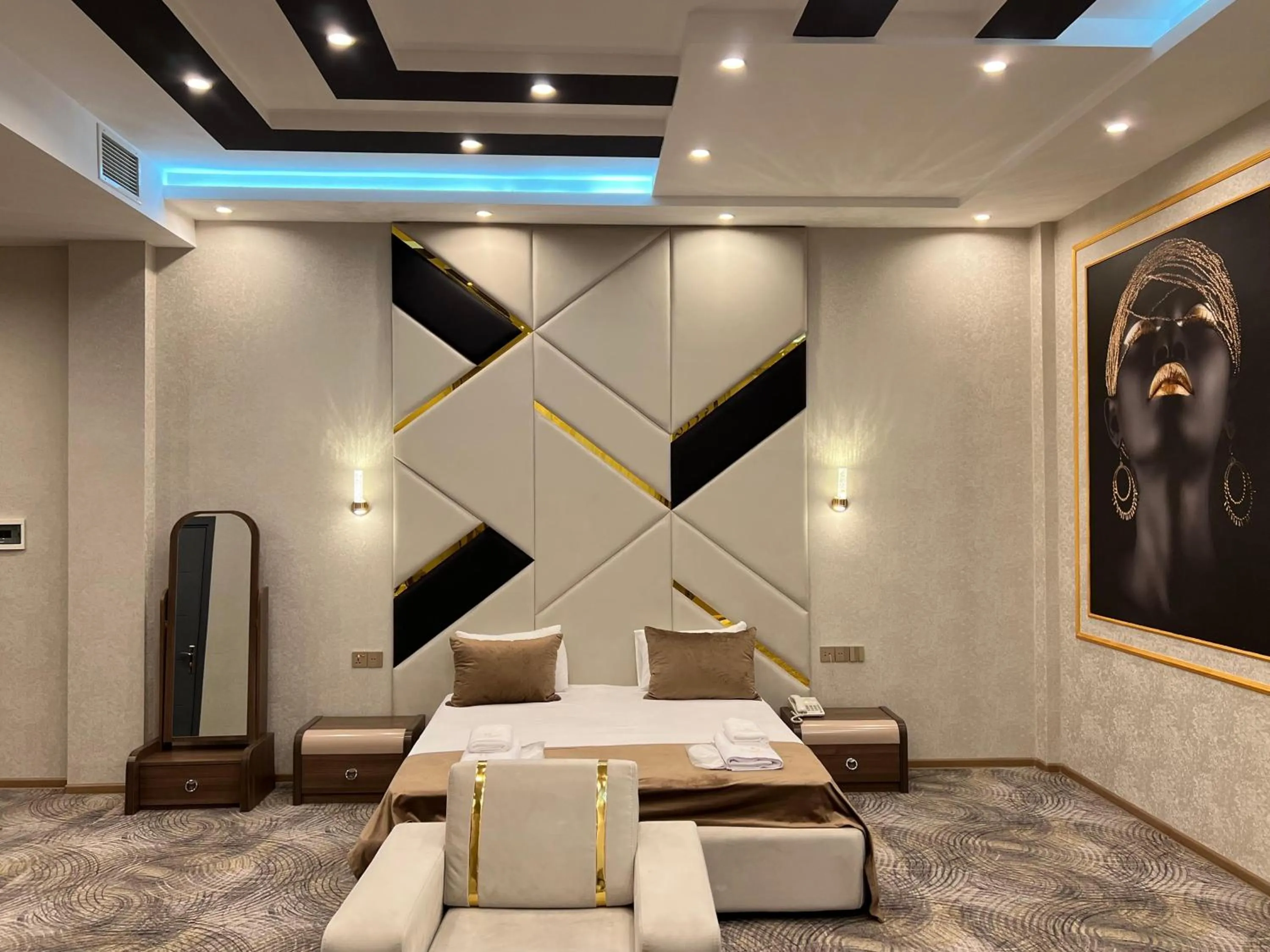 Bed in Royal Mansion Hotel