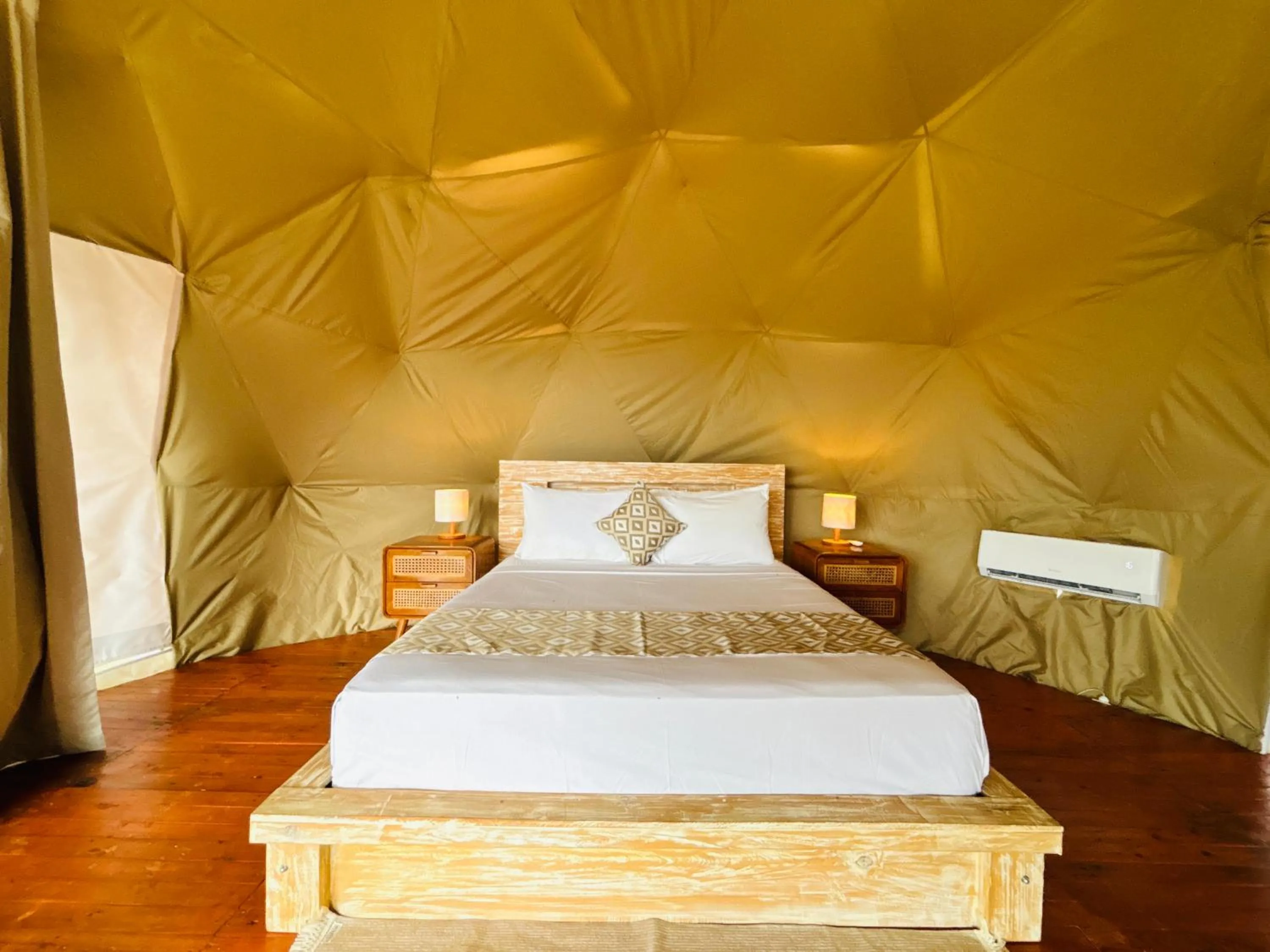 Bed in De'Ra Hills Camp Kintamani