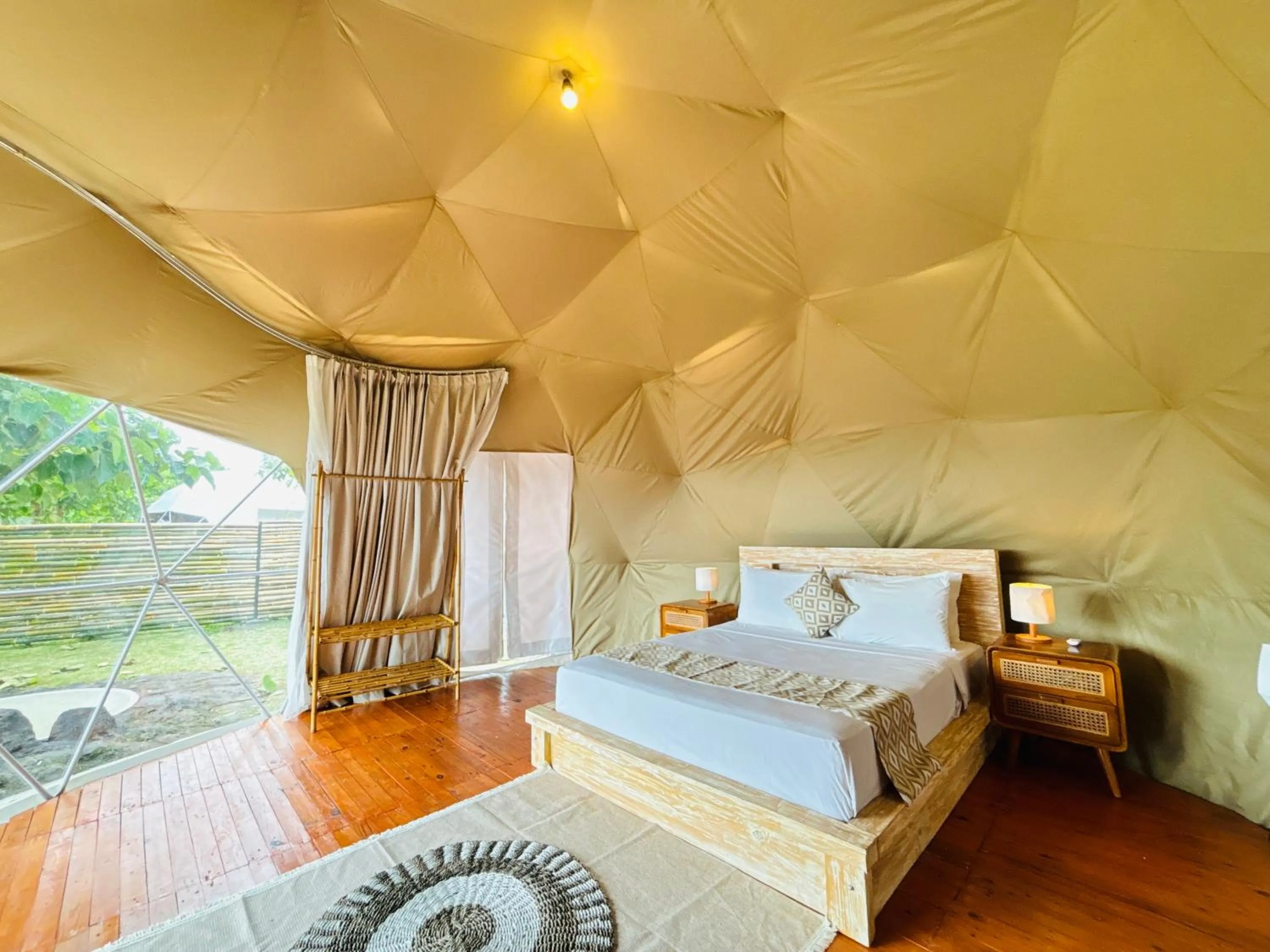 Bed in De'Ra Hills Camp Kintamani