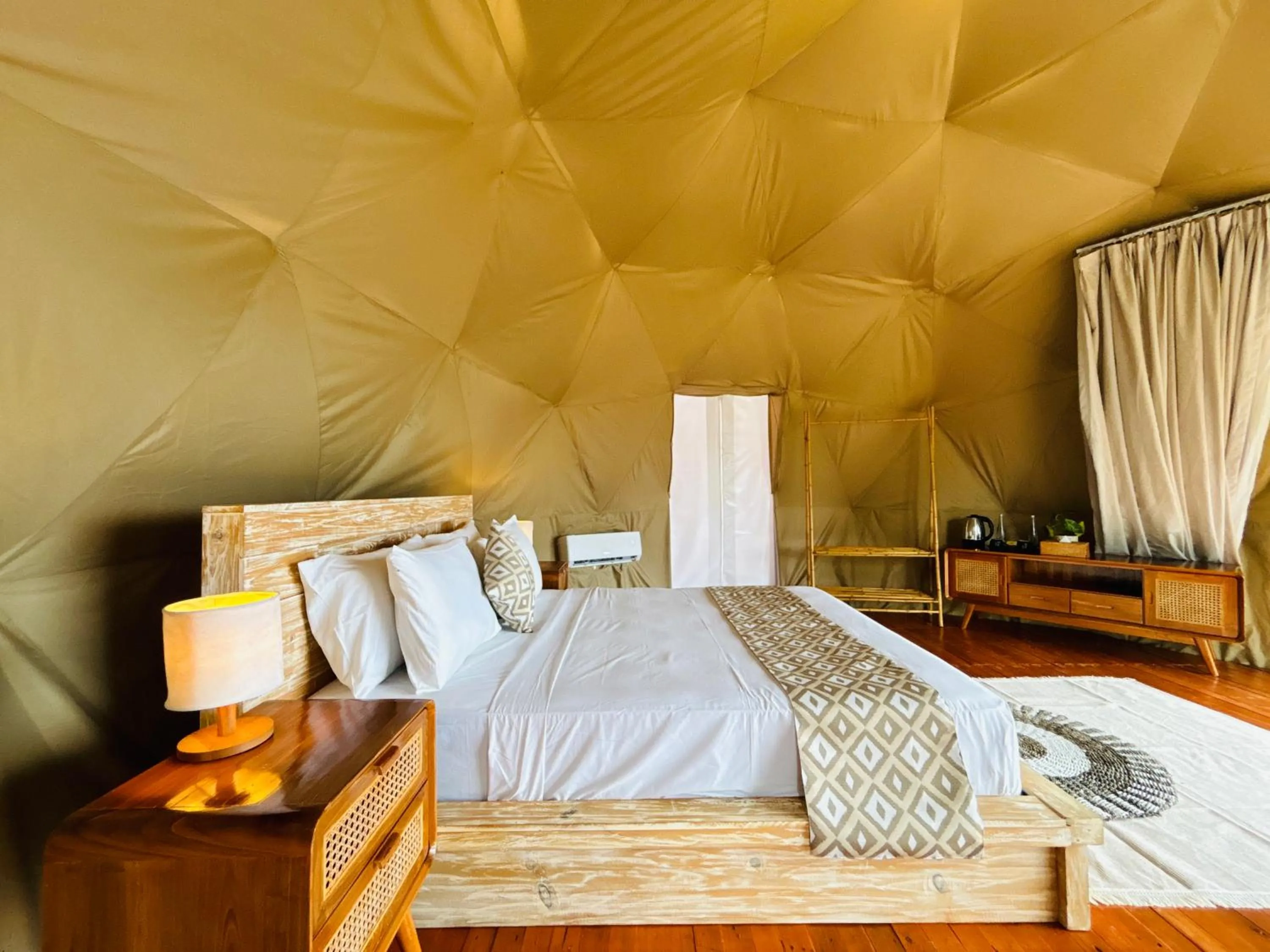 Bed in De'Ra Hills Camp Kintamani