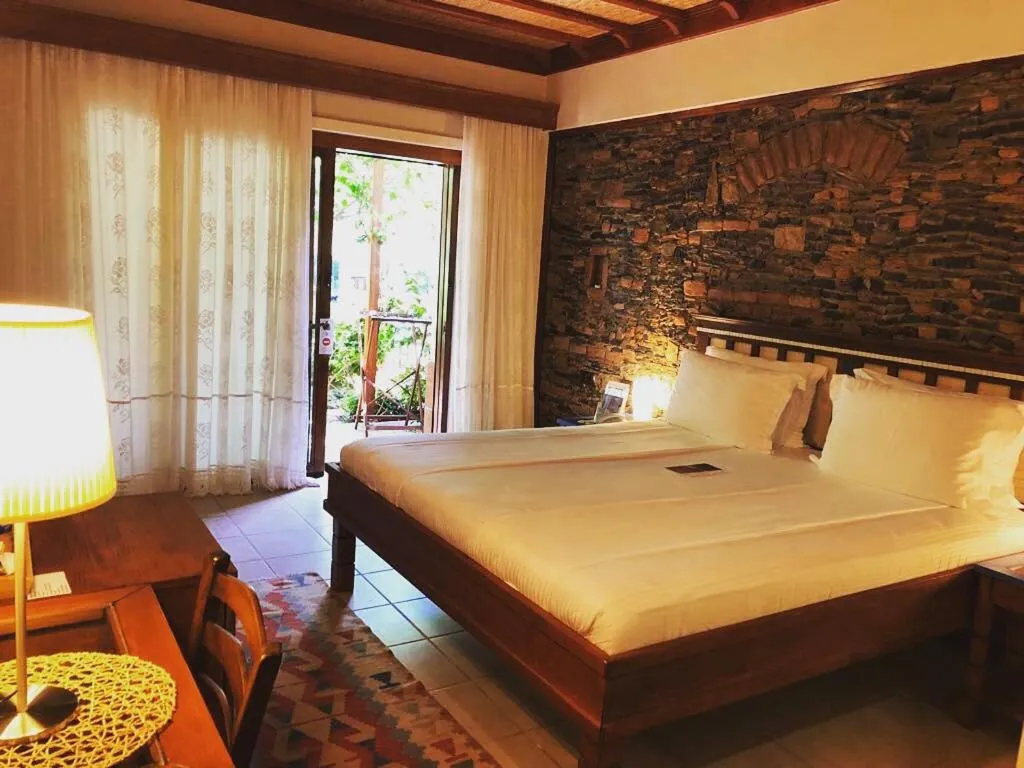 Bed in El Vino Hotel & Suites