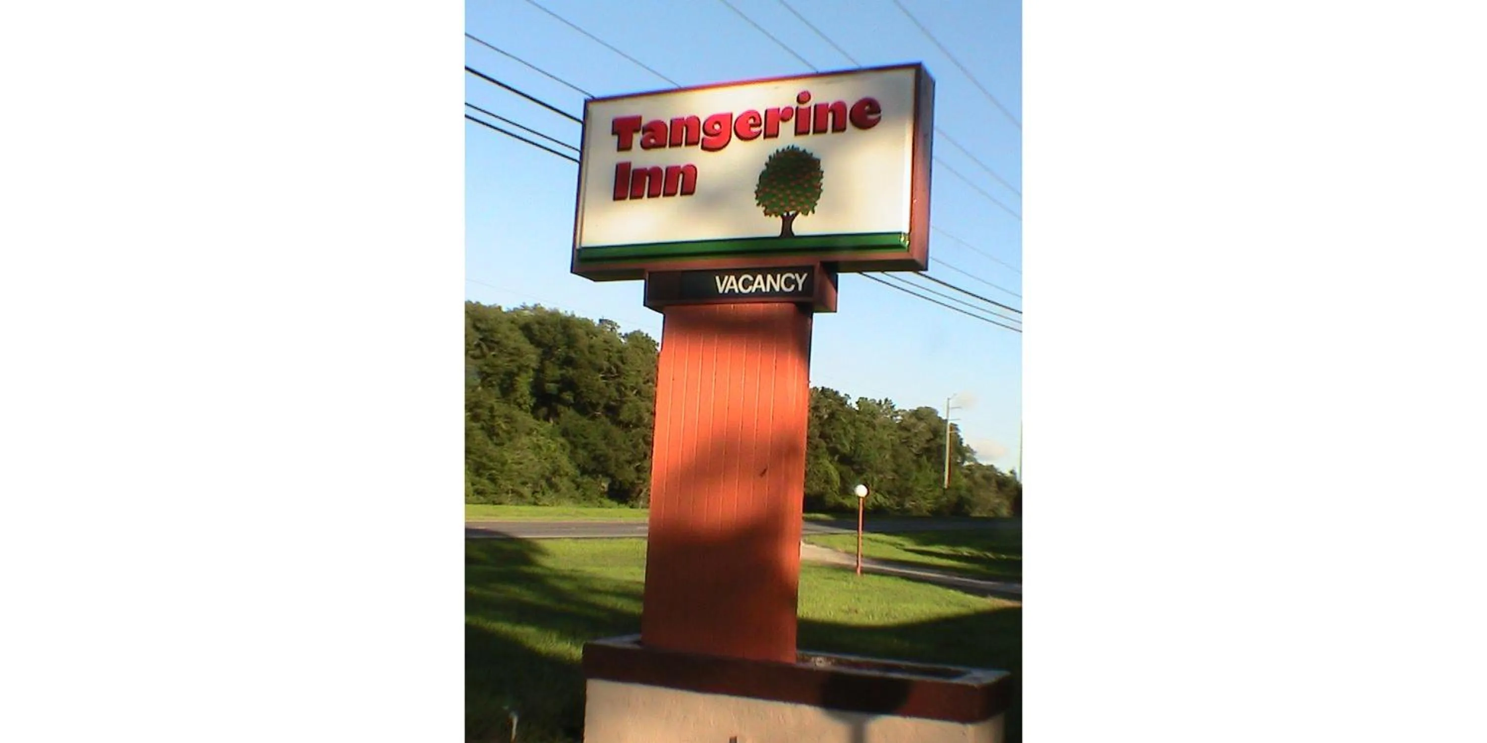 Property logo or sign in At Home Express Tangerine Inn