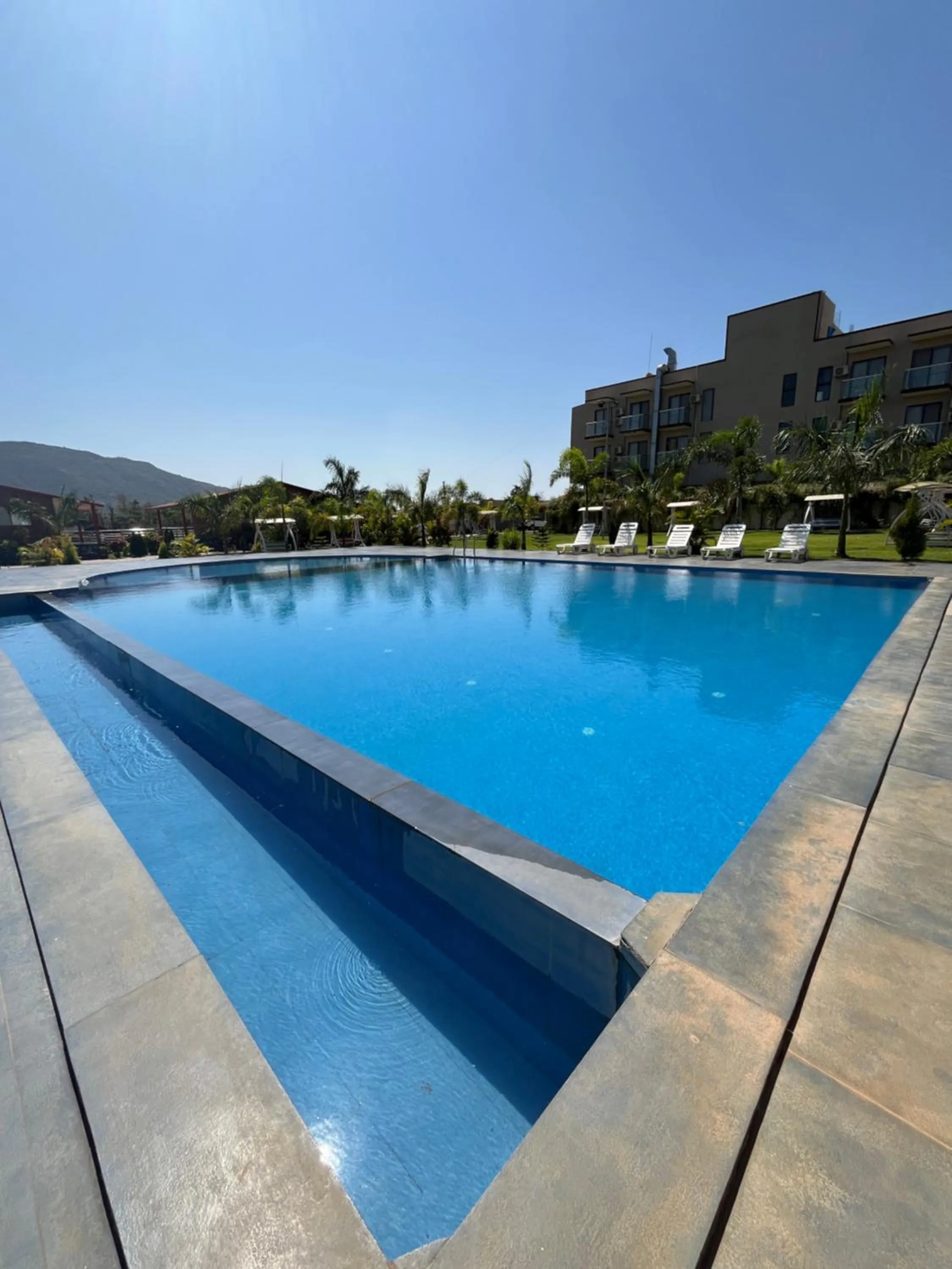 Swimming pool in Daksh The Valley Resort - Saputara