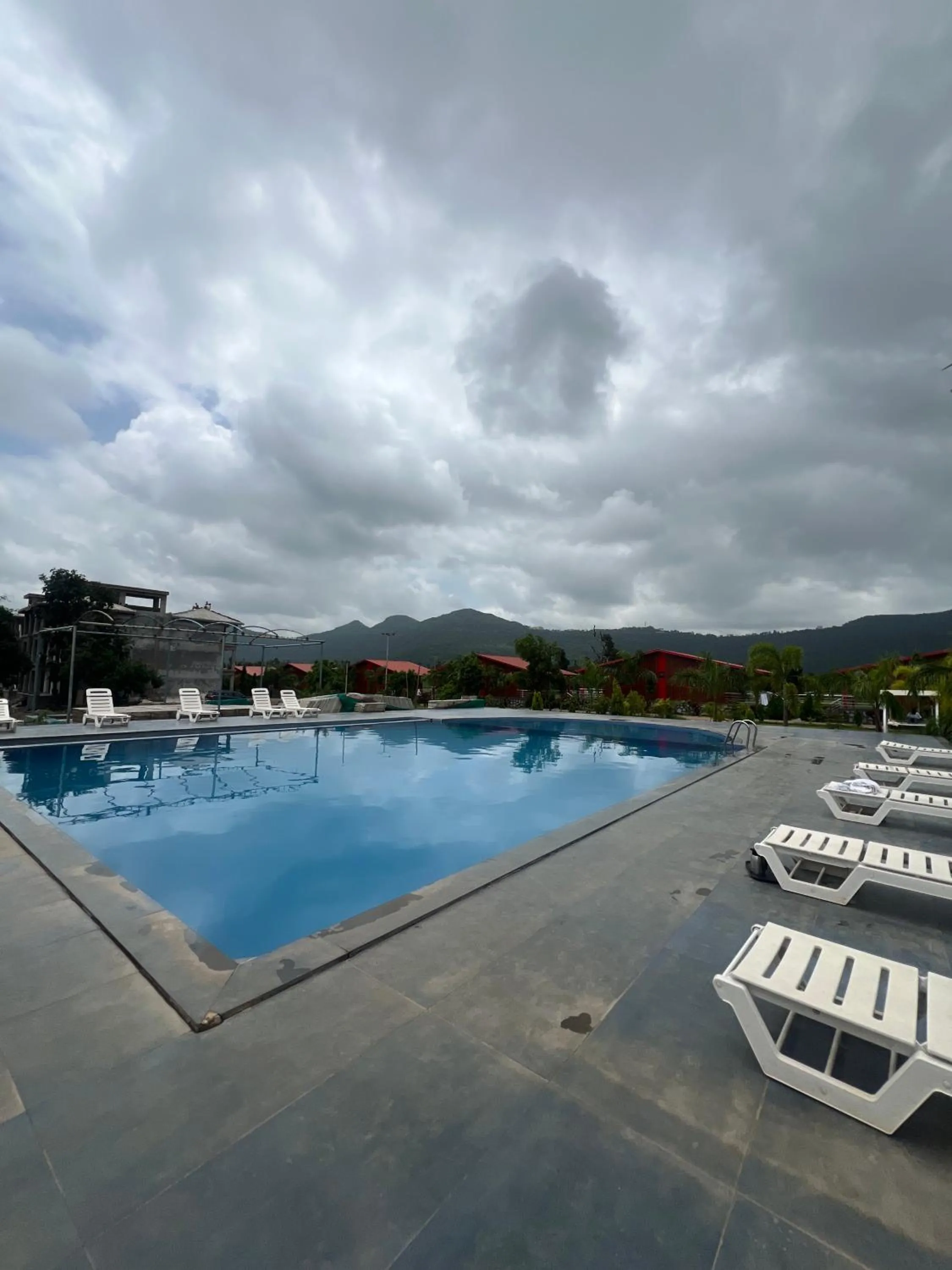 Swimming pool in Daksh The Valley Resort - Saputara