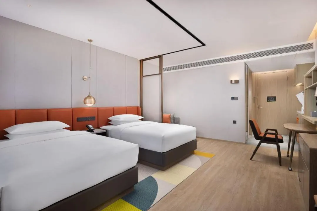 Bed in Home2 Suite by Hilton Shenyang Yuhong