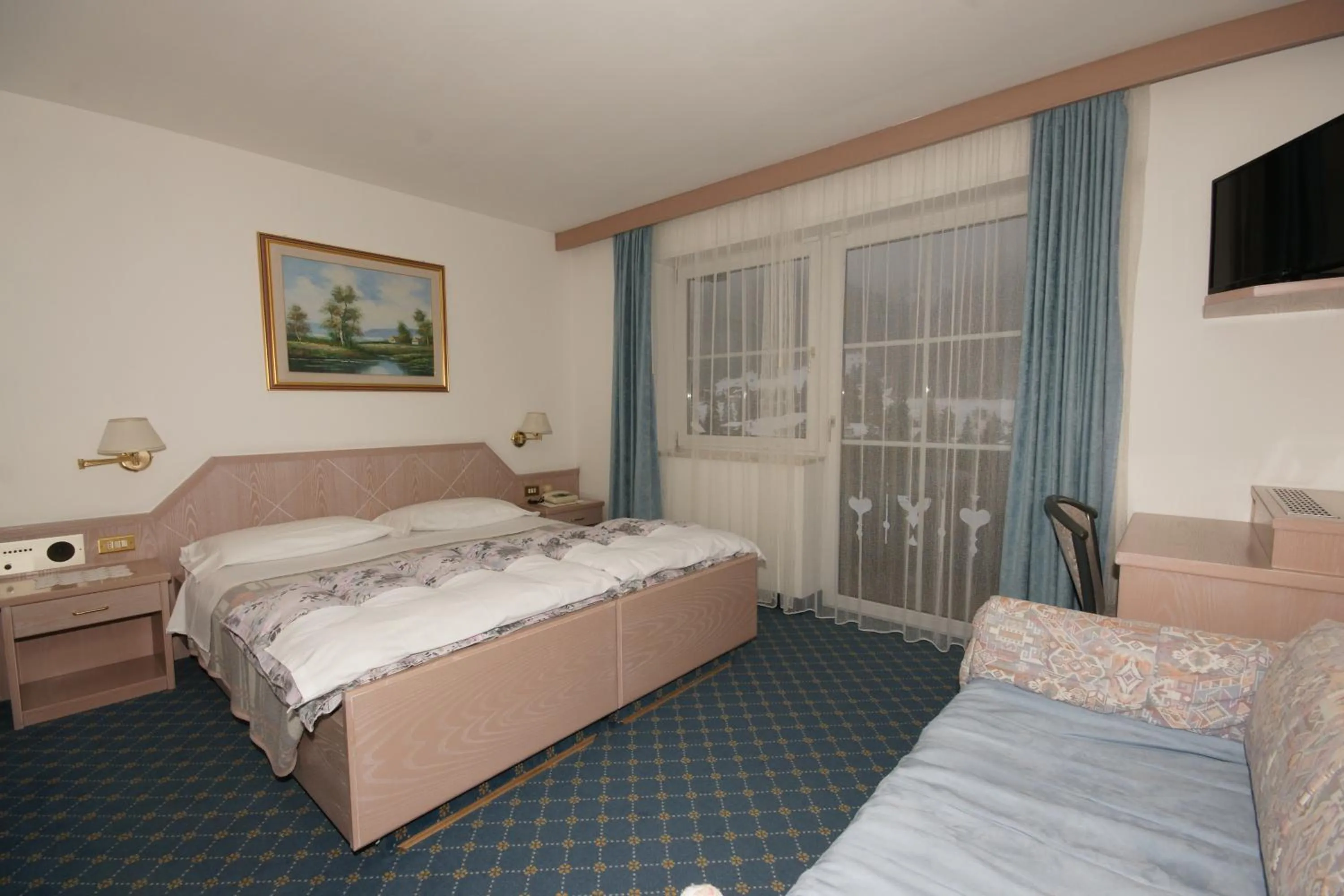 Bed in Hotel Villa Mozart