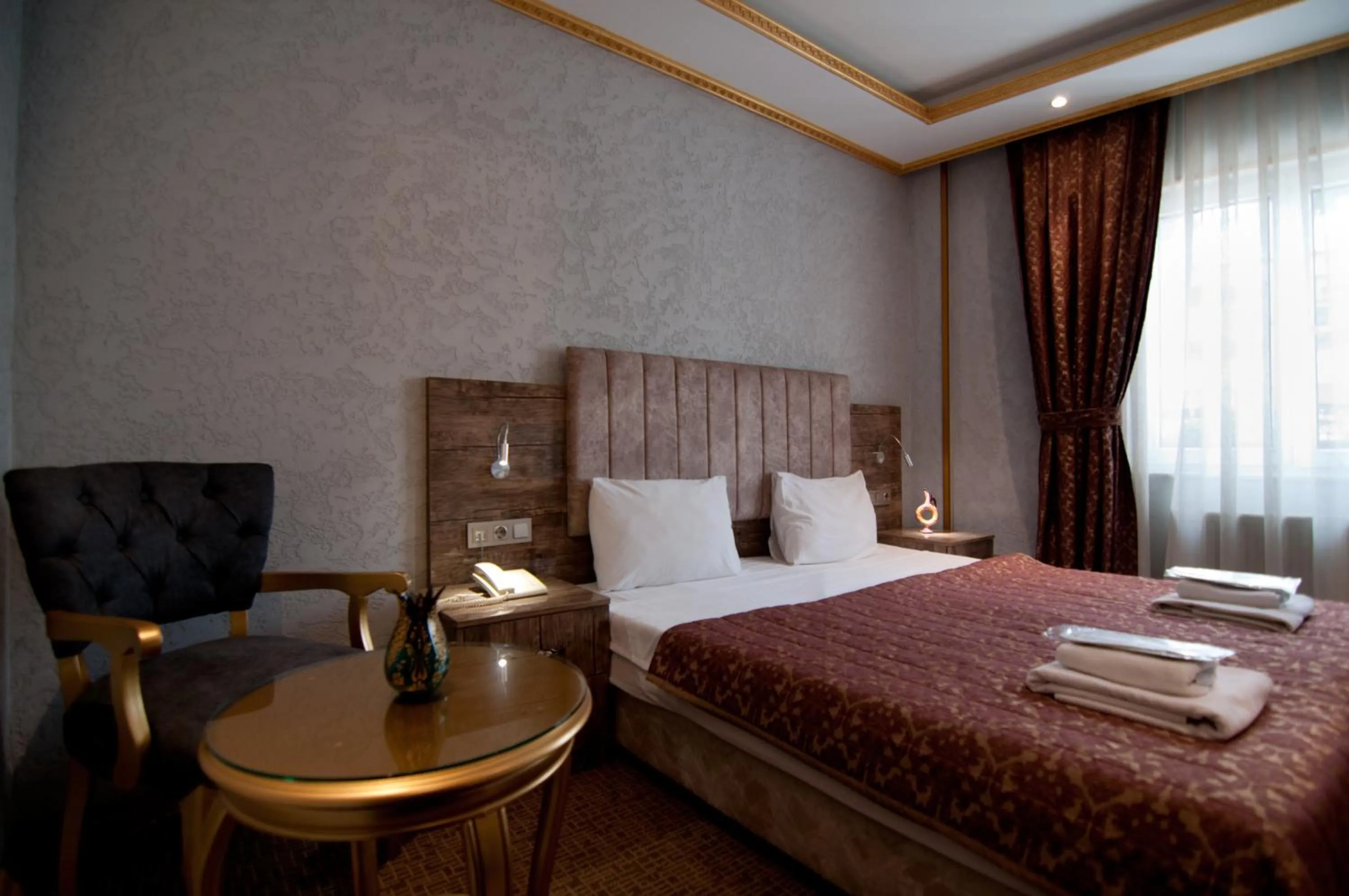 Photo of the whole room, Bed in Grand Ambiance Hotel