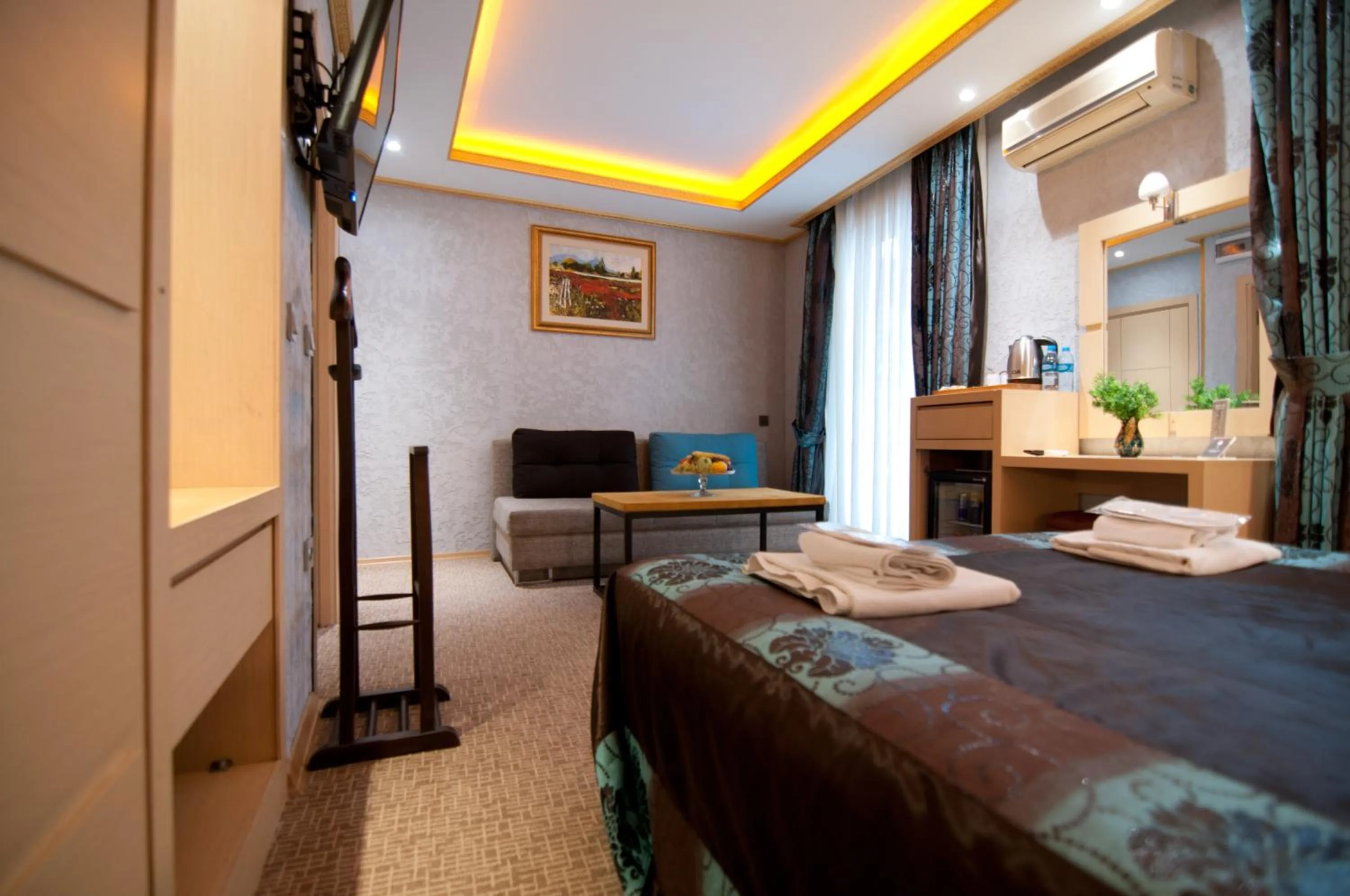 Photo of the whole room, Bed in Grand Ambiance Hotel