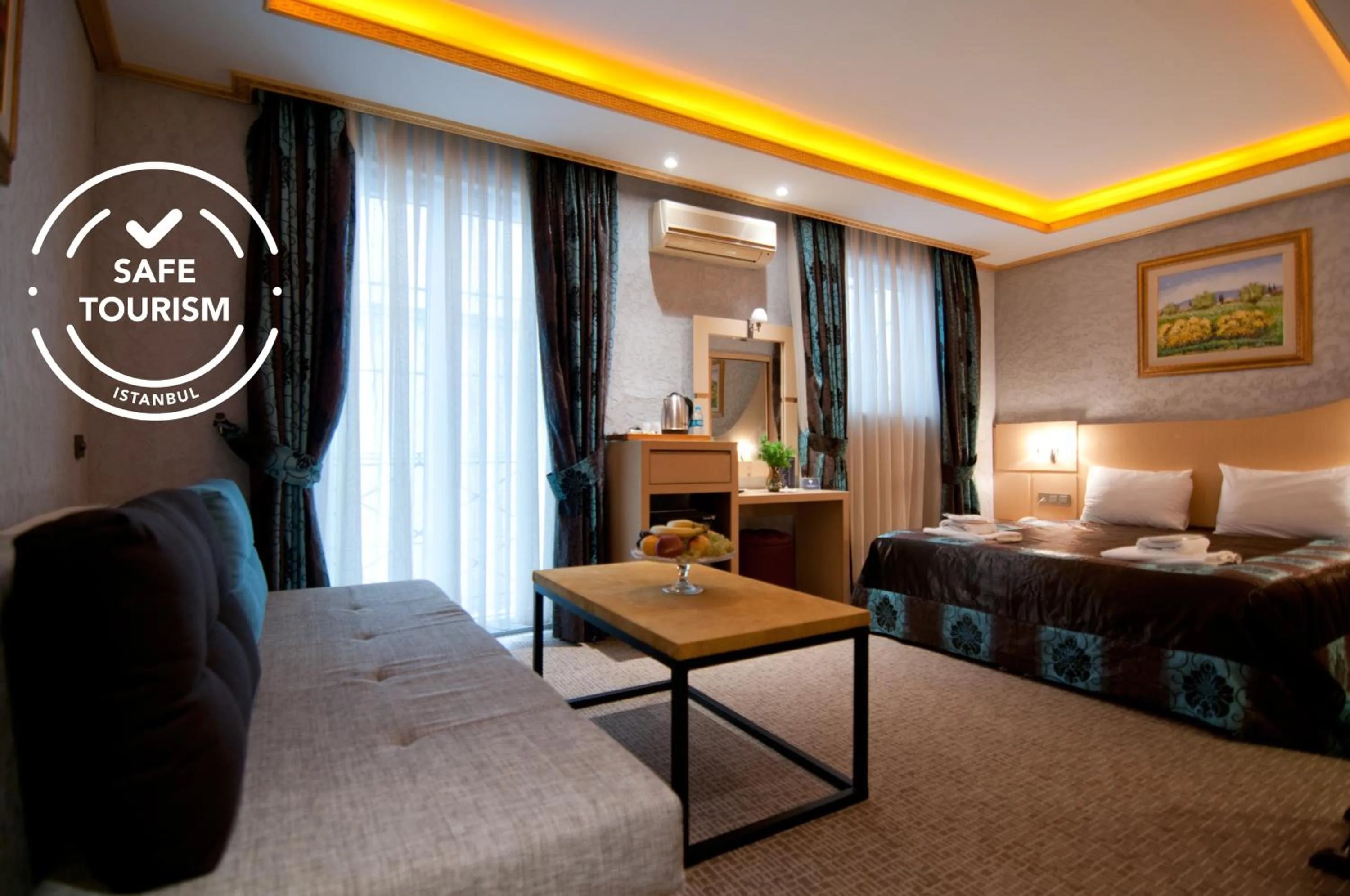 Bed in Grand Ambiance Hotel