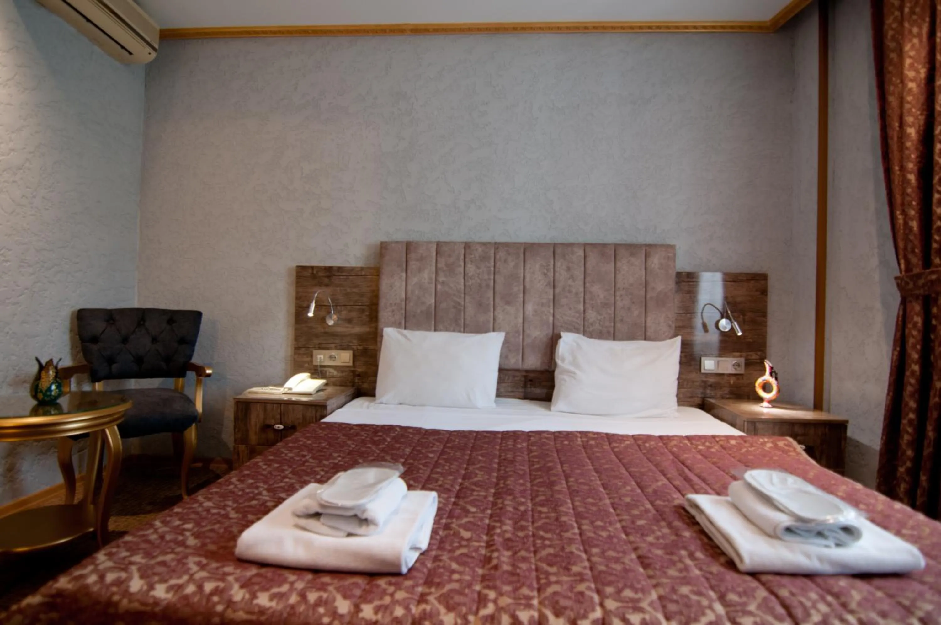 Photo of the whole room, Bed in Grand Ambiance Hotel