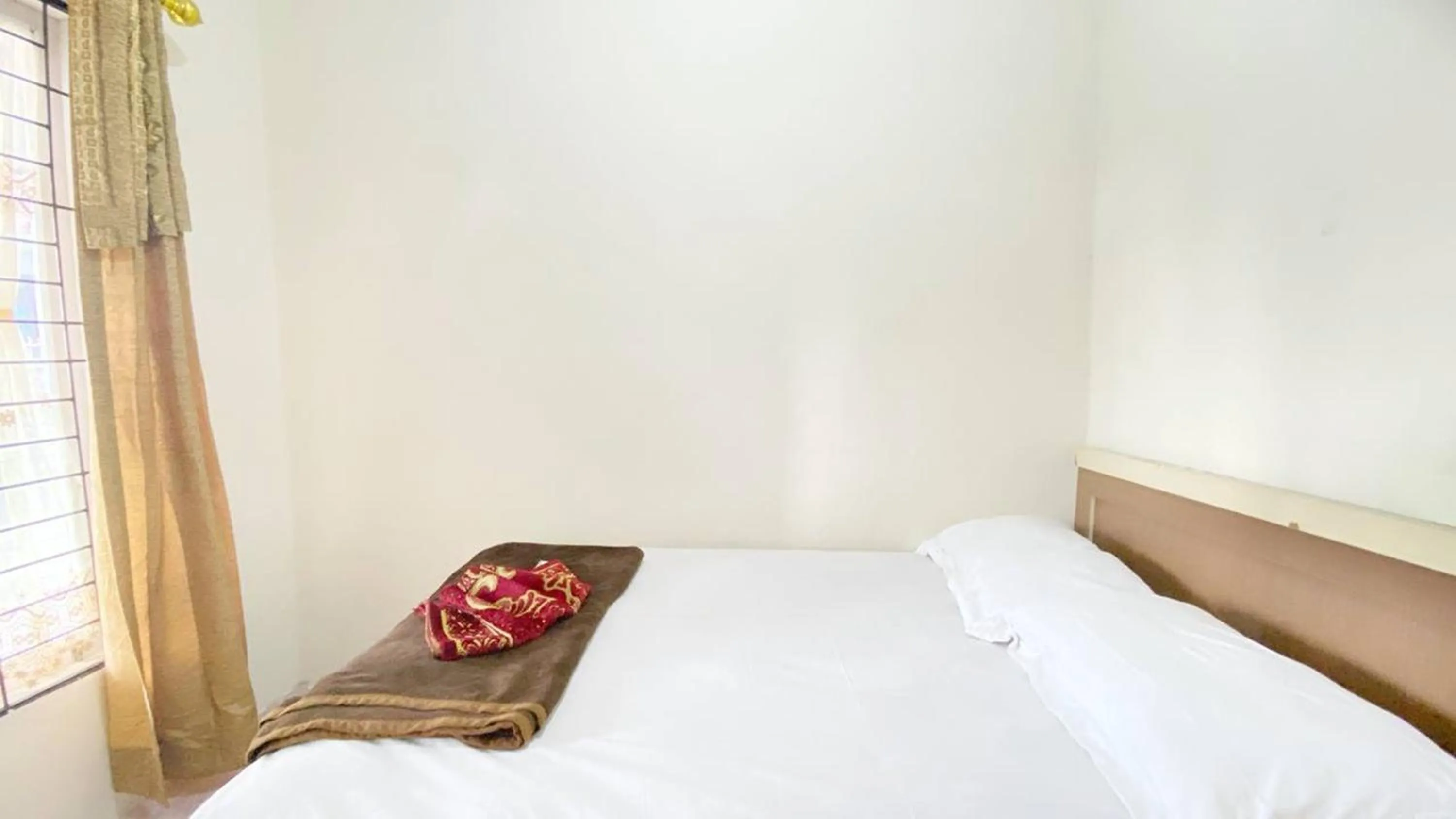 Bed in Villa Palacios Syari'ah Bukittinggi