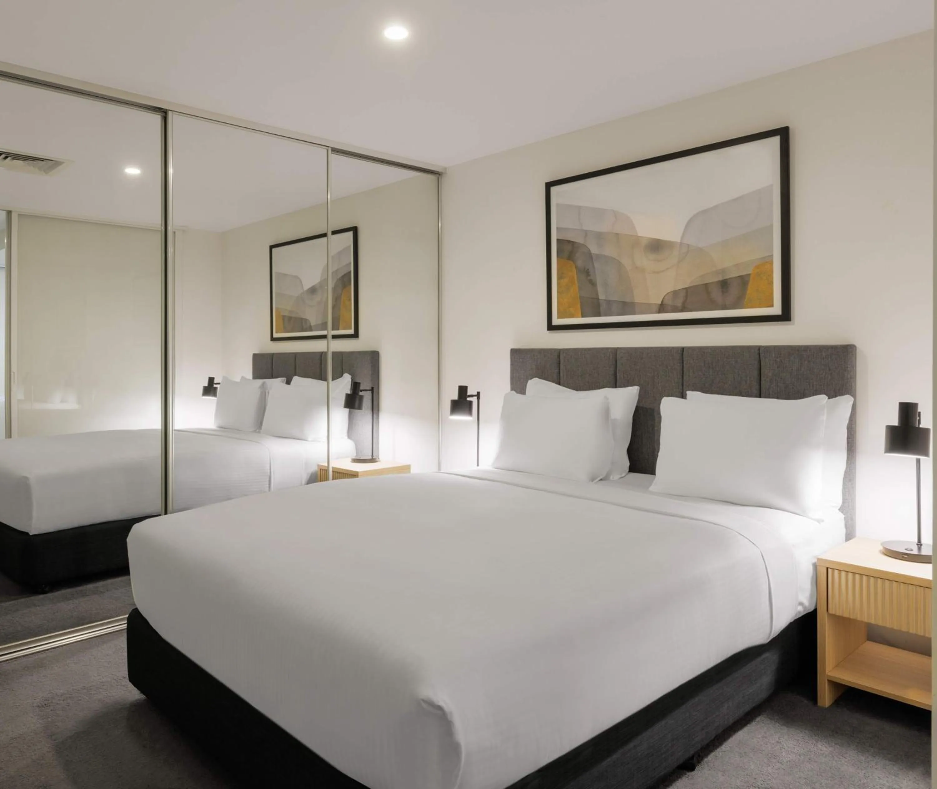 Bed in Oaks Melbourne Flemington Suites