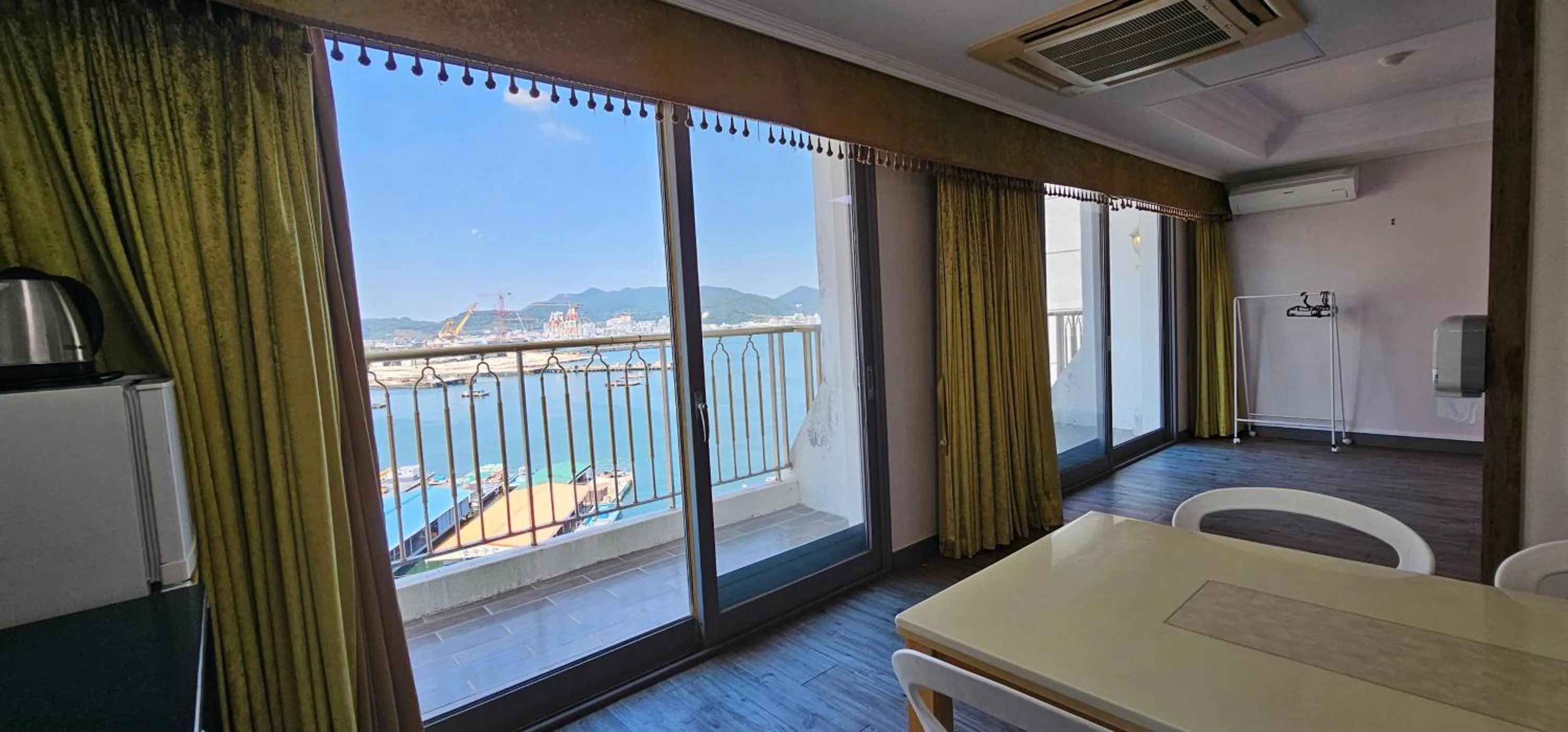 Bed in Tongyeong Bay Condo Hotel