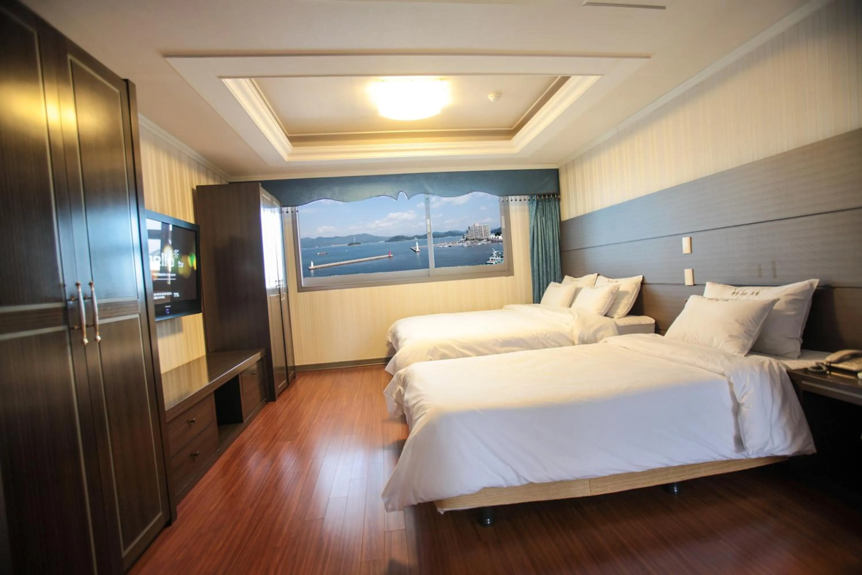 Bed in Tongyeong Bay Condo Hotel