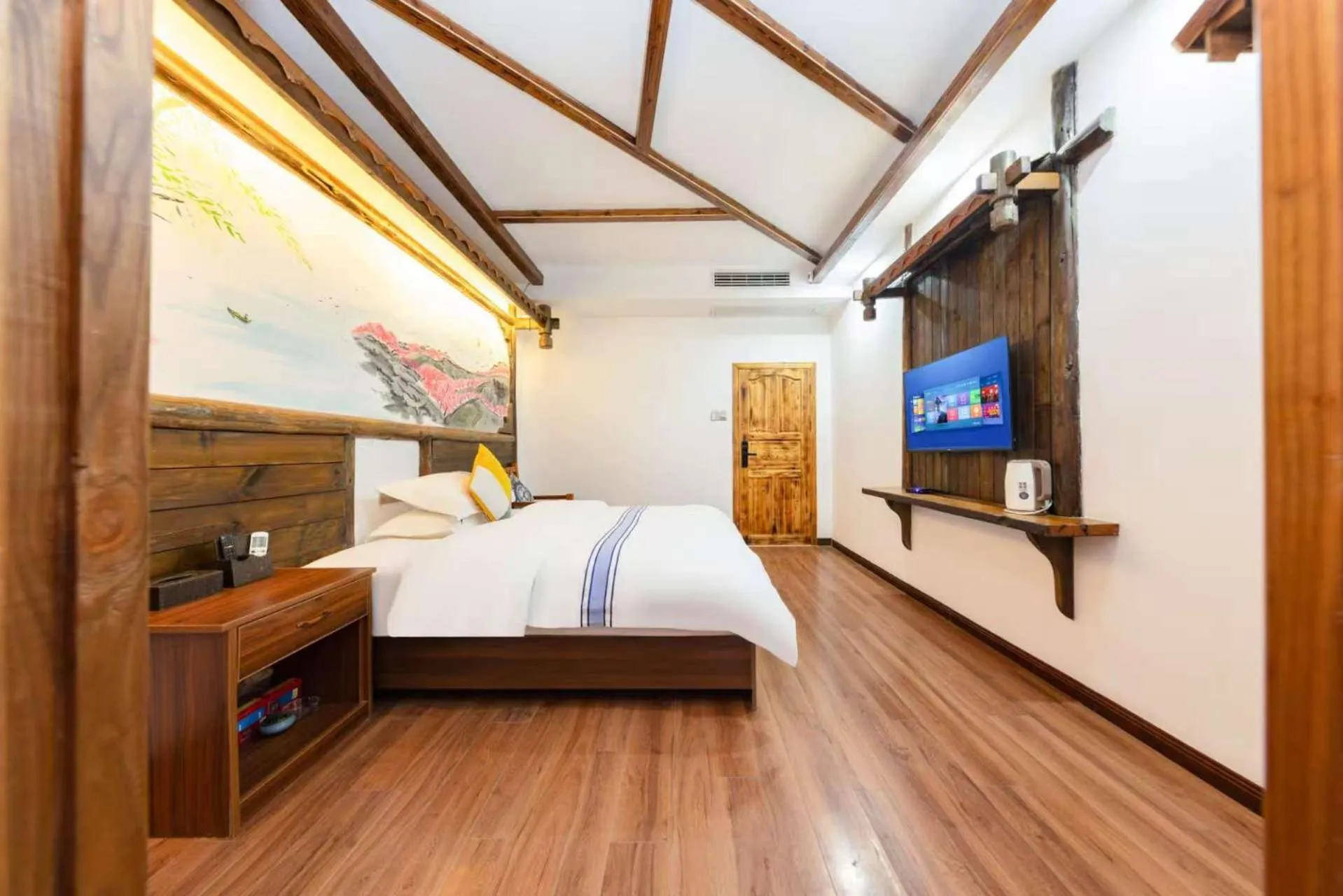 Photo of the whole room, Bed in Hotel California Zhangjiajie