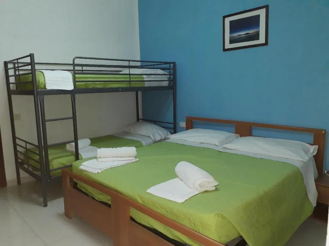 Bed in Pensione Nettuno