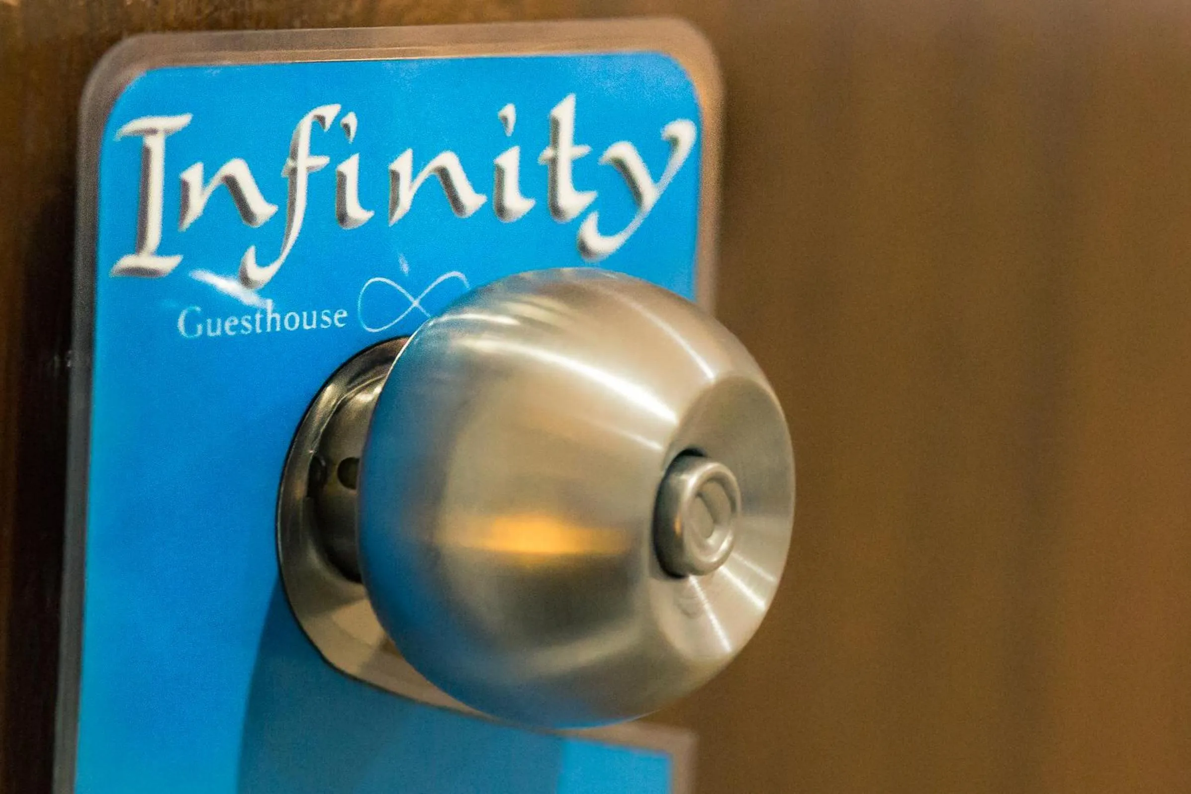 Property logo or sign in Infinity Guesthouse