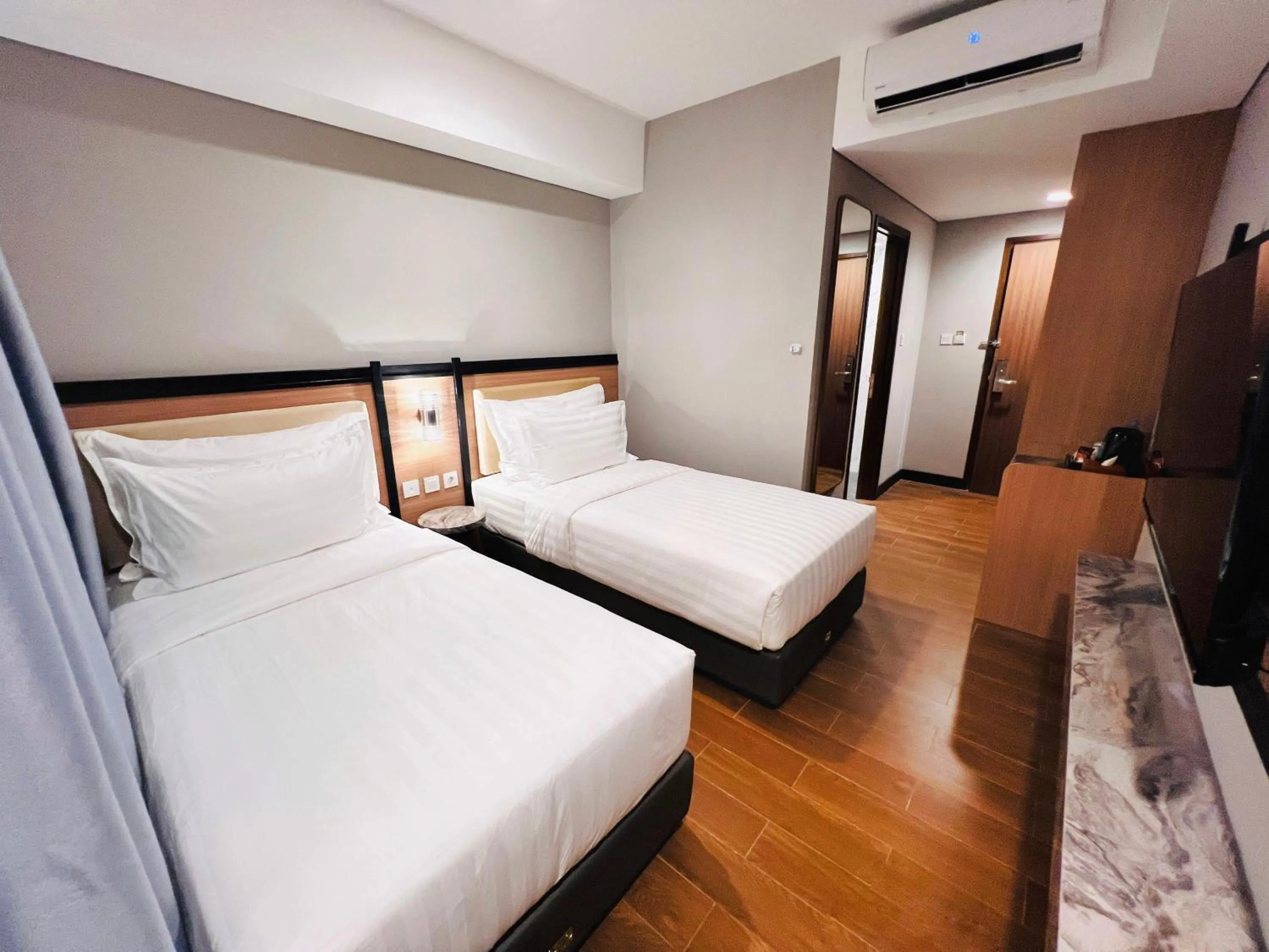 Bed in d'primahotel Airport Sultan Hasanuddin Makassar