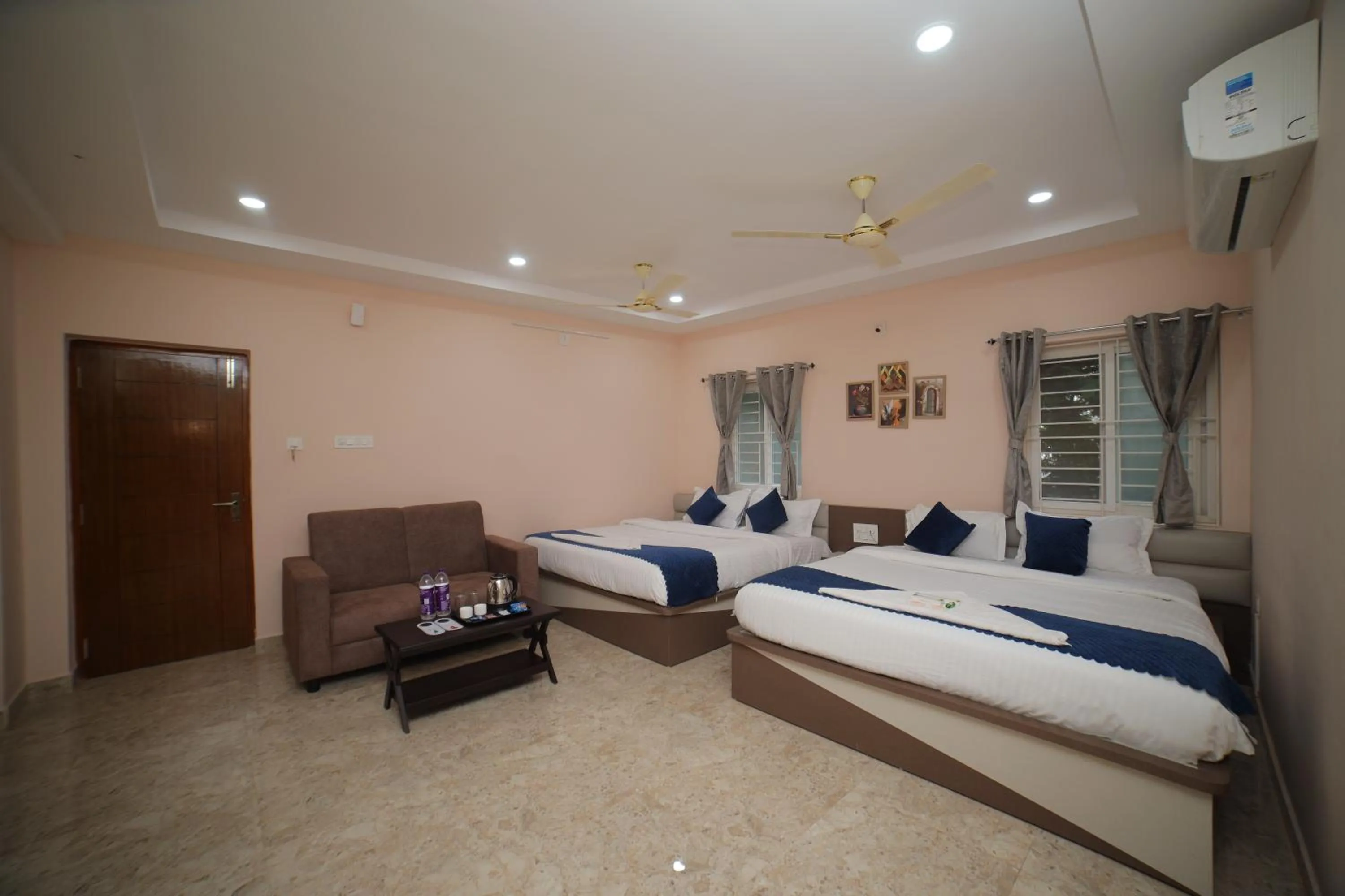 Photo of the whole room, Bed in Sri Ganesh Grand
