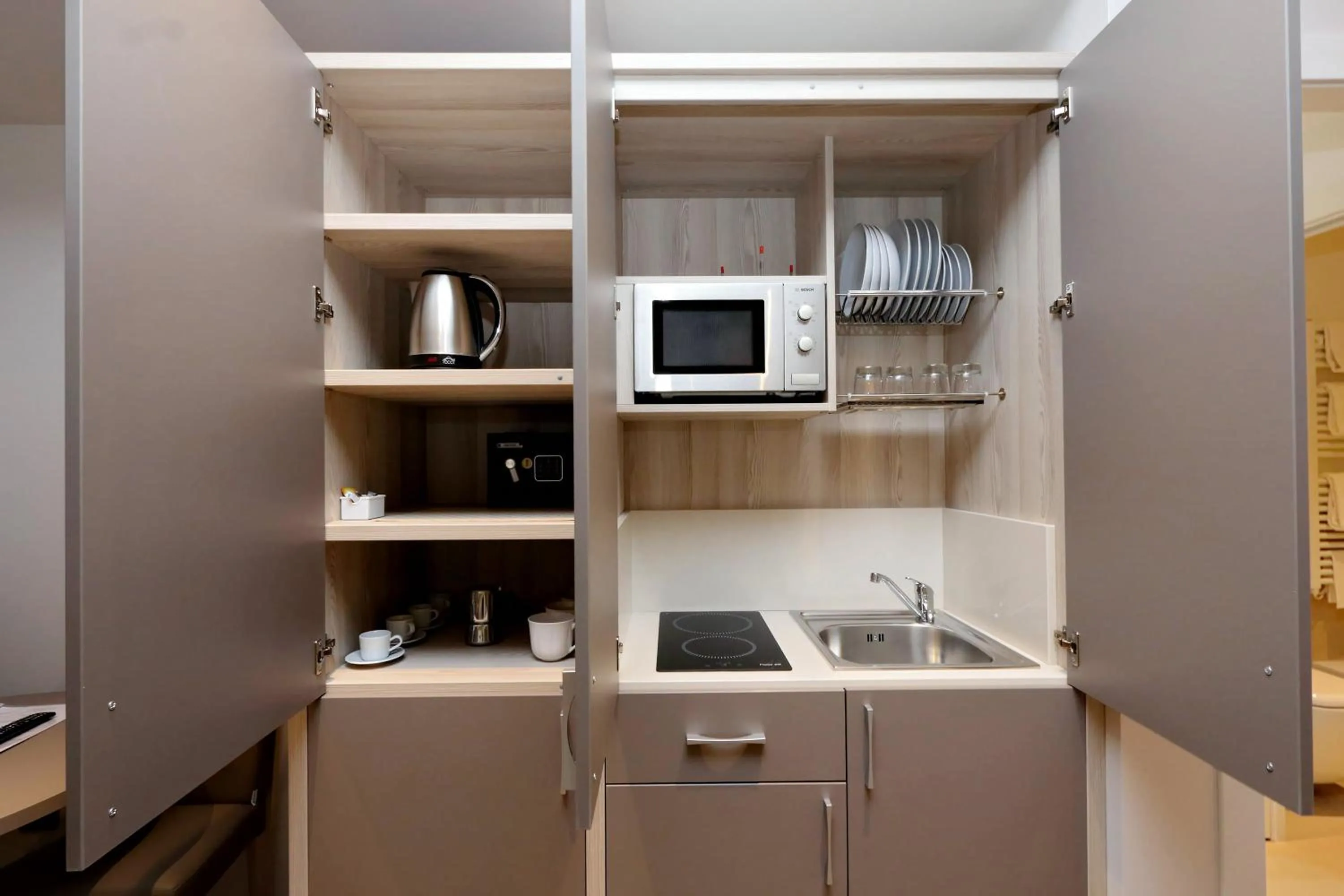 Kitchen or kitchenette in Duomo Hotel & Apartments