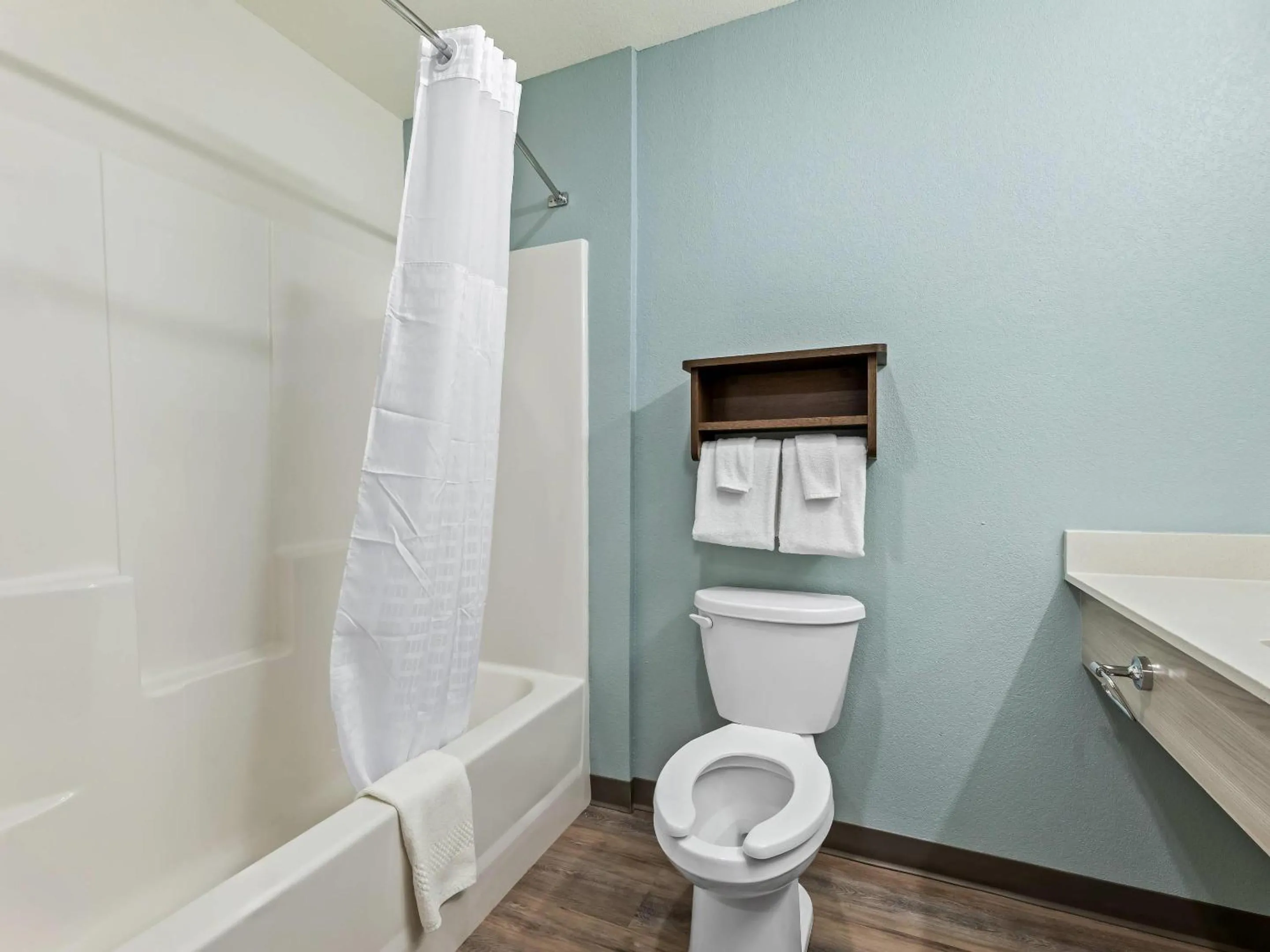 Bedroom in WoodSpring Suites Prattville - Montgomery North