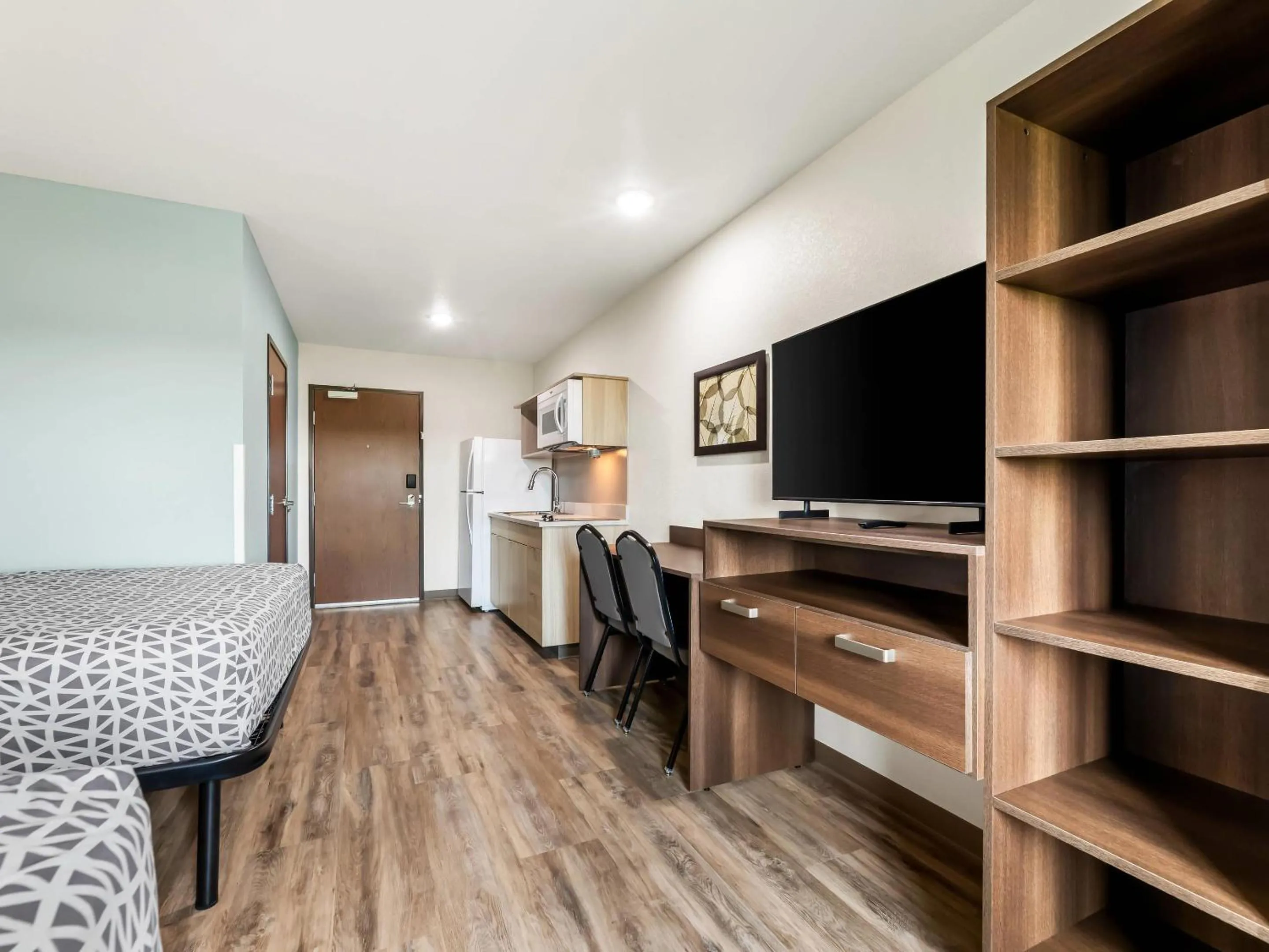 Bedroom in WoodSpring Suites Prattville - Montgomery North