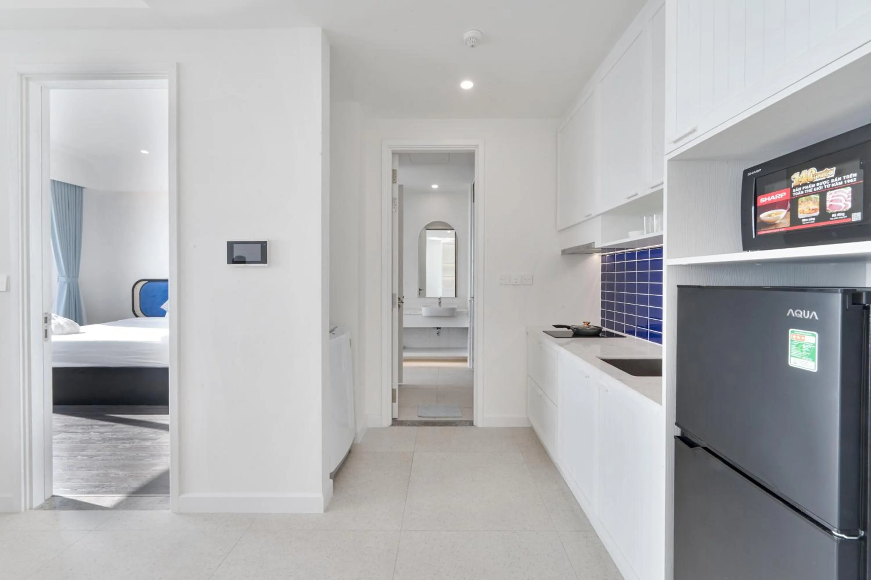 Kitchen or kitchenette, Bed in La isla Apartments & Villas - Sea View & Fireworks Phu Quoc